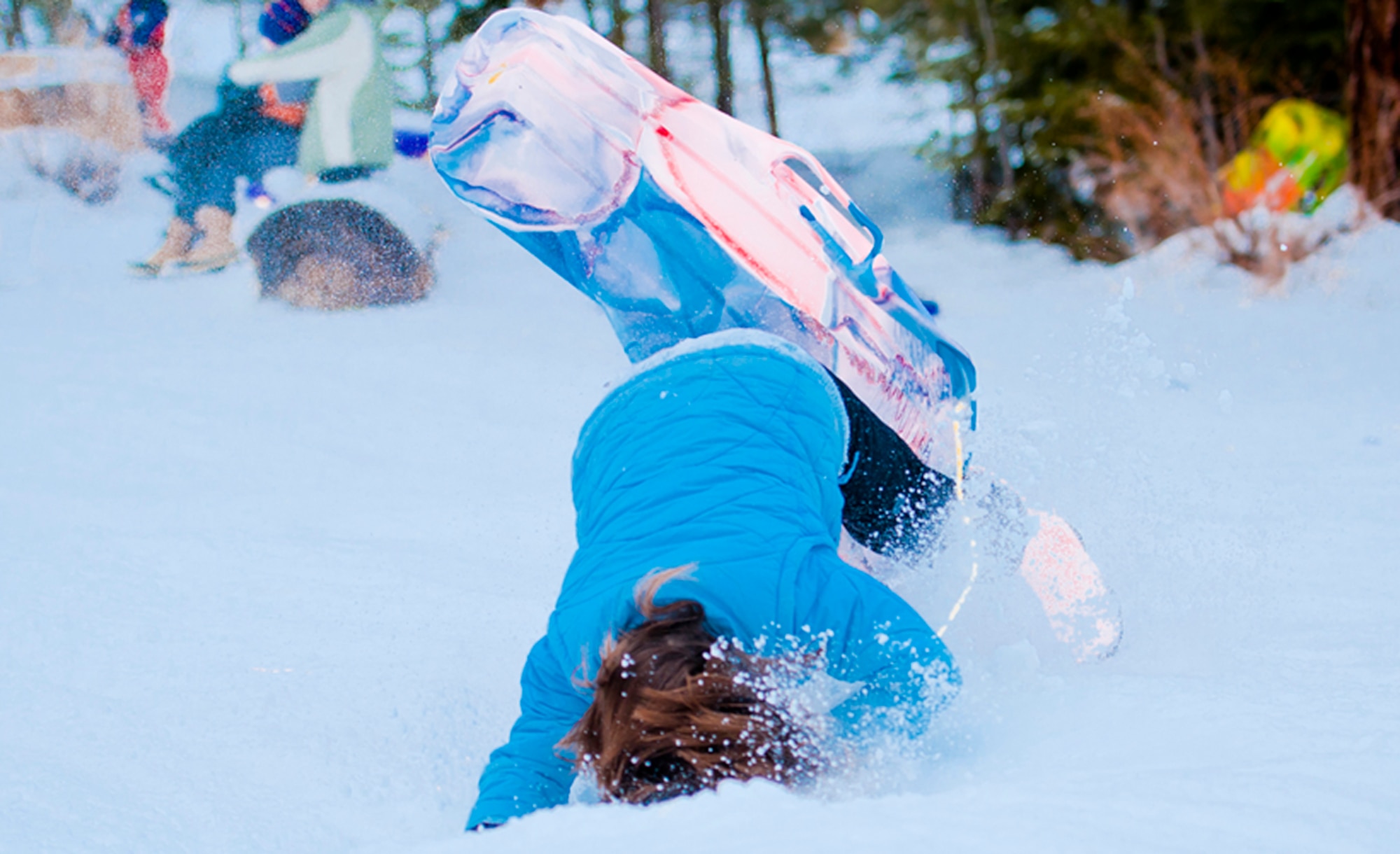 ALTERNATE ENDINGS: Sliding downhill is an exhilarating winter sport. People of all ages can participate, and use all kinds of containers, from large toboggans to plastic disks or even cardboard boxes. But accidental injuries from sledding are surprisingly common despite snow’s cushioning effect. (Photo by Tech. Sgt. Samuel Bendet)