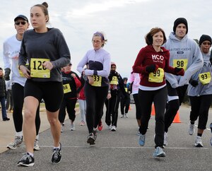 Runners participate in the second annual “Race ‘Round the Base” at Langley Air Force Base, Va., Dec. 10, 2011. More than 150 runners participated in the event, and had the option of completing a 5-kilometer or a 10-mile route around the base. (U.S. Air Force photo by Airman 1st Class Teresa Cleveland/Released) 
