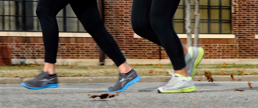 Runners participate in the second annual “Race ‘Round the Base” at Langley Air Force Base, Va., Dec. 10, 2011. More than 150 runners participated in the event, and had the option of completing a 5-kilometer or a 10-mile route around the base. Trophies were given to the fastest  5-kilometer and 10-mile male and female runners of the race, and plaques given for winners of each age group. (U.S. Air Force photo by Staff Sgt. Dana Hill/Released)