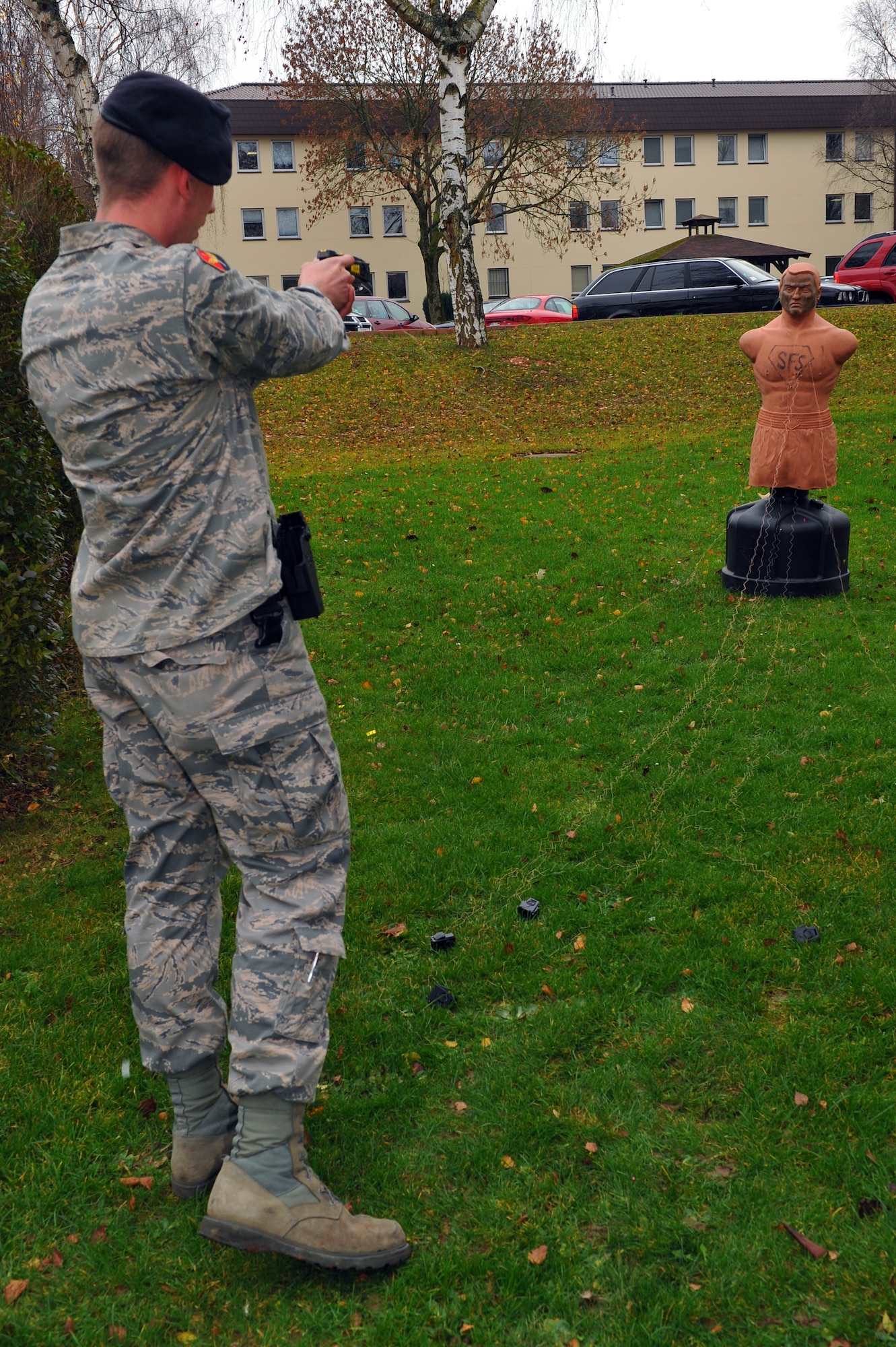 SPANGDAHLEM AIR BASE, Germany – Gabriel Kastner, 52nd Security Forces Squadron police officer, fires a Taser X26 electronic control device into a dummy target during training outside Bldg. 127 here Dec. 8. Training for the Taser X26 electronic control device consists of a classroom comprehension course, hands-on field training and a supervised firing course. Students complete Taser training to ensure they are able to safely handle and operate all Taser equipment. (U.S. Air Force photo/Airman 1st Class Dillon Davis)