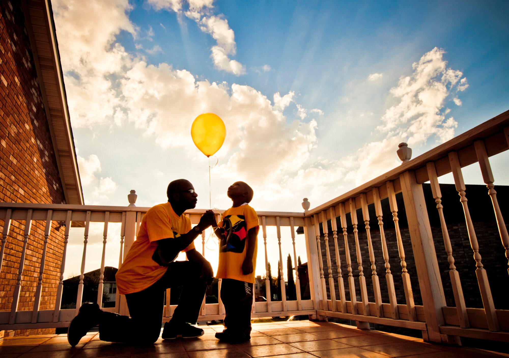 CHILD ORPHANED BY DRUNK DRIVER NOW LOSES GRANDPA: Nathaniel Britt and his grandpa, retired Master Sgt. Ronald Lee, release a balloon Nov. 11, 2010, to celebrate his mother’s birthday. Tech. Sgt. Audra Britt was killed by a drunk driver in April 2009. Lee died of a stroke Sept. 24. (Photo by Tech. Sgt. Samuel Bendet)