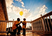 CHILD ORPHANED BY DRUNK DRIVER NOW LOSES GRANDPA: Nathaniel Britt and his grandpa, retired Master Sgt. Ronald Lee, release a balloon Nov. 11, 2010, to celebrate his mother’s birthday. Tech. Sgt. Audra Britt was killed by a drunk driver in April 2009. Lee died of a stroke Sept. 24. (Photo by Tech. Sgt. Samuel Bendet)