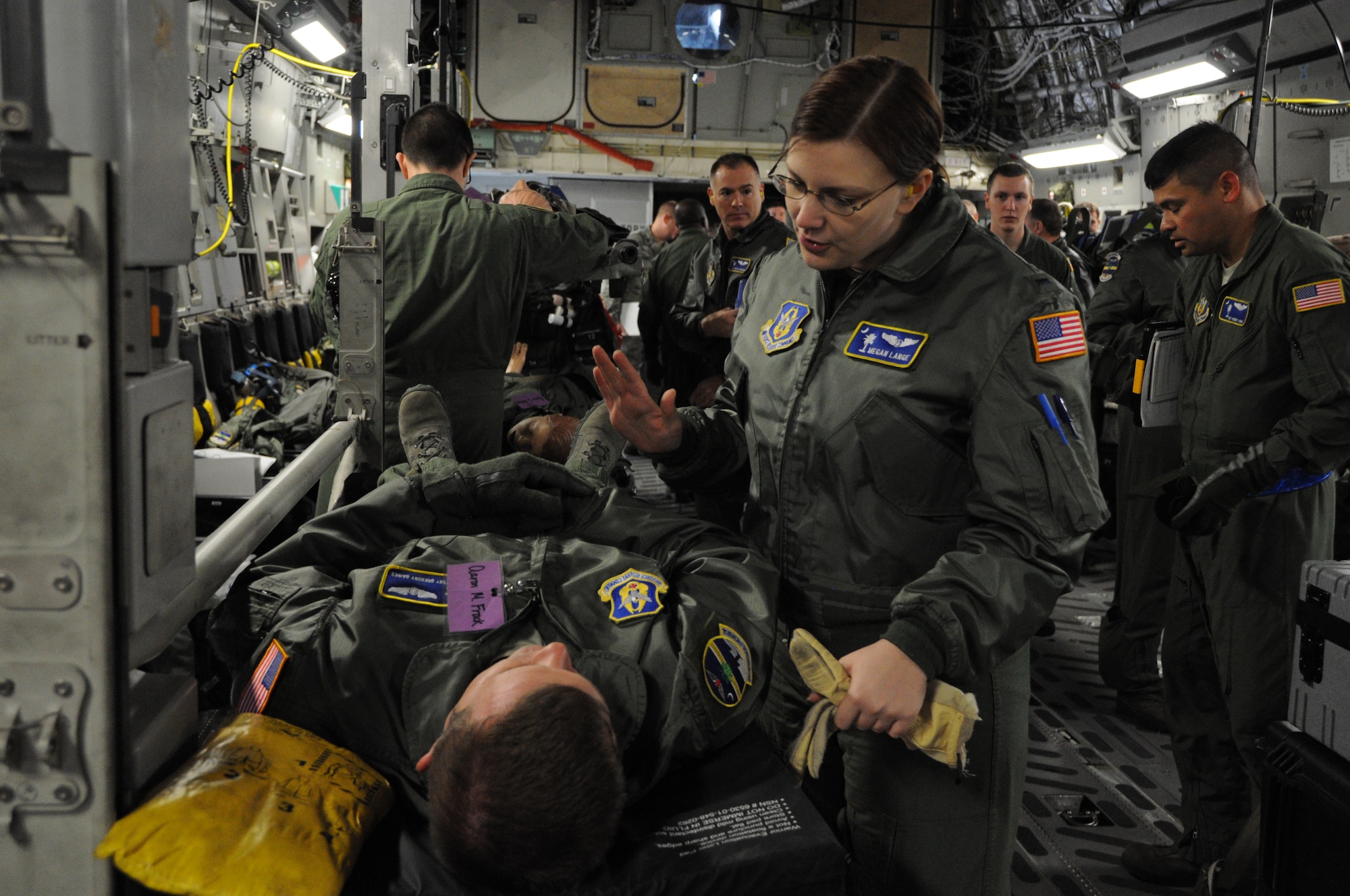 1st Lt. Megan Lange prepares for a training mission aboard a C-17 Globemaster III aircraft Dec. 10, 2011 at Joint Base Charleston, S.C. Lieutenant Lange is a flight nurse with the 315th Aeromedical Evacuation Squadron at JBC, and she is trained and equipped to provide in-flight medical care aboard the C-17 Globemaster III and other mission directed aircraft. (U.S. Air Force photo/Staff Sgt. Shane Ellis)  
