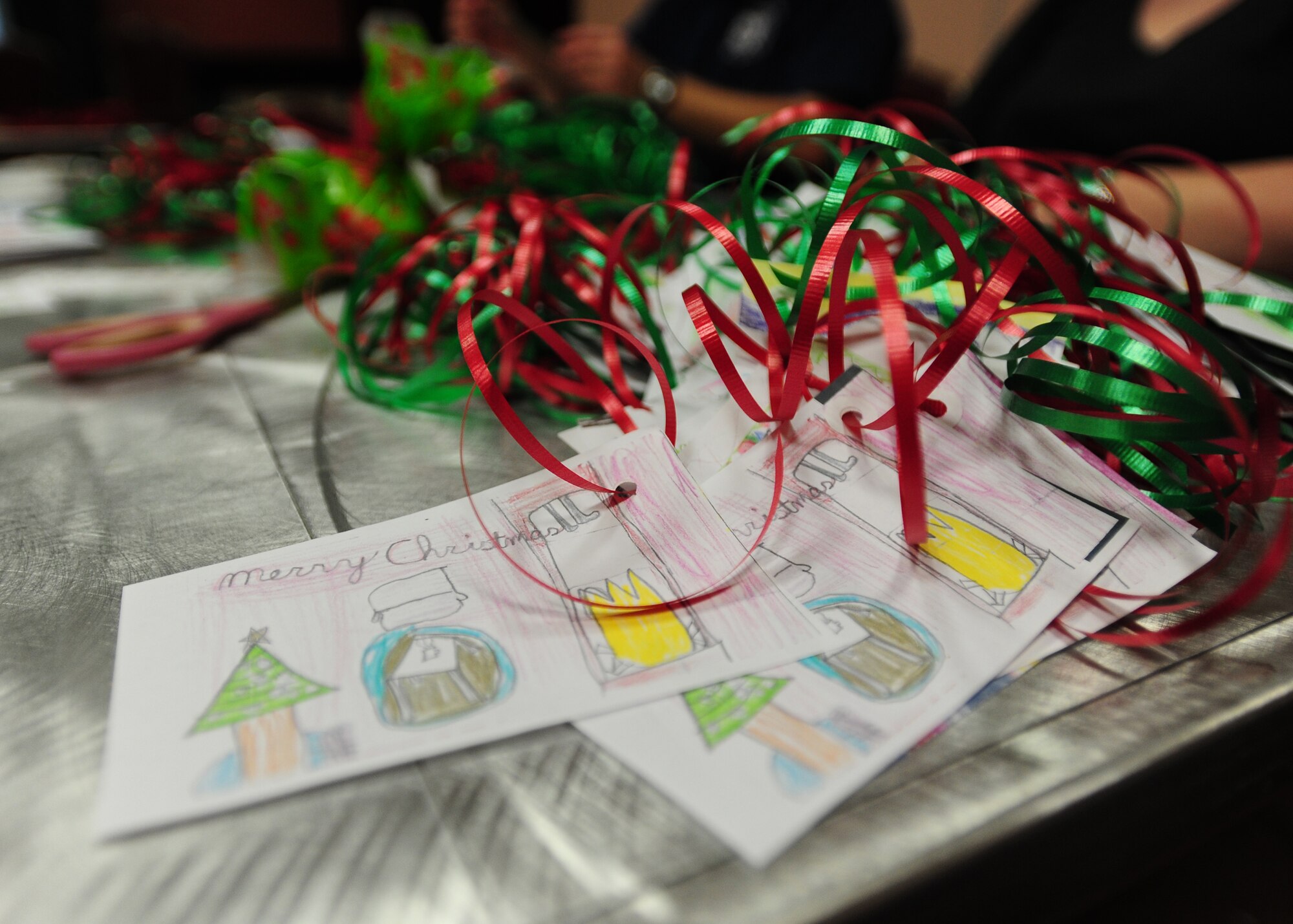 The 2011 Airmen Cookie Drive kicks off Dec. 12 at La Bella Vista Club on Aviano Air Base, Italy.  Aviano Officers and Civilian Spouses' Club, and Aviano Community Enlisted Spouses Club as well as other volunteers collected and baked 11,700 cookies for dorm residents and Operation Yellow Ribbon. (U.S. Air Force Photo/Staff Sgt. Evelyn Chavez)