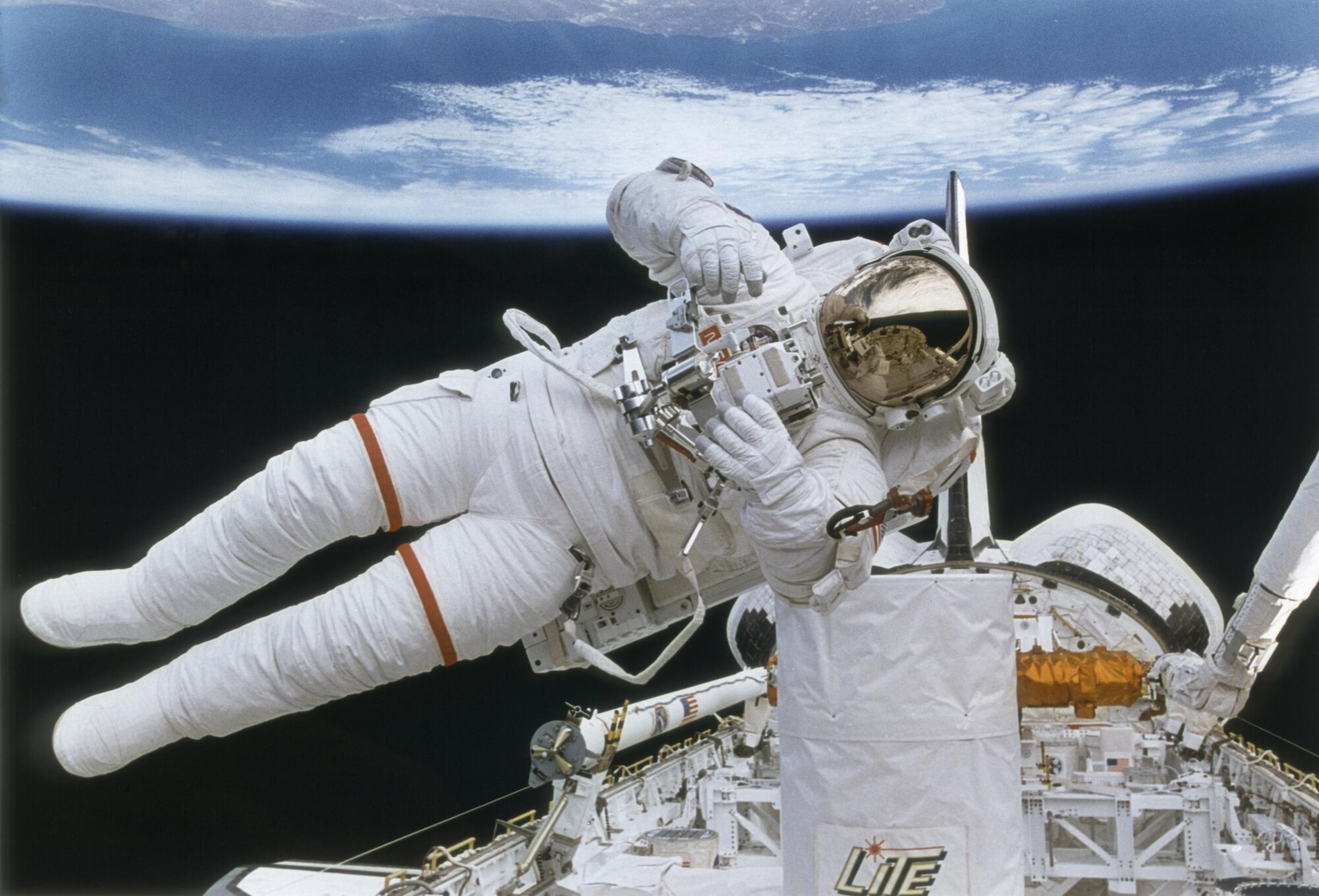 Astronaut Mark Lee tests the backpack called Simplified Aid for Extra-Vehicular Activity  Rescue in 1994. Active duty Airmen can apply for an assignment with NASA through USAJobs' website through Jan. 12, 2012. (Courtesy photo/NASA)