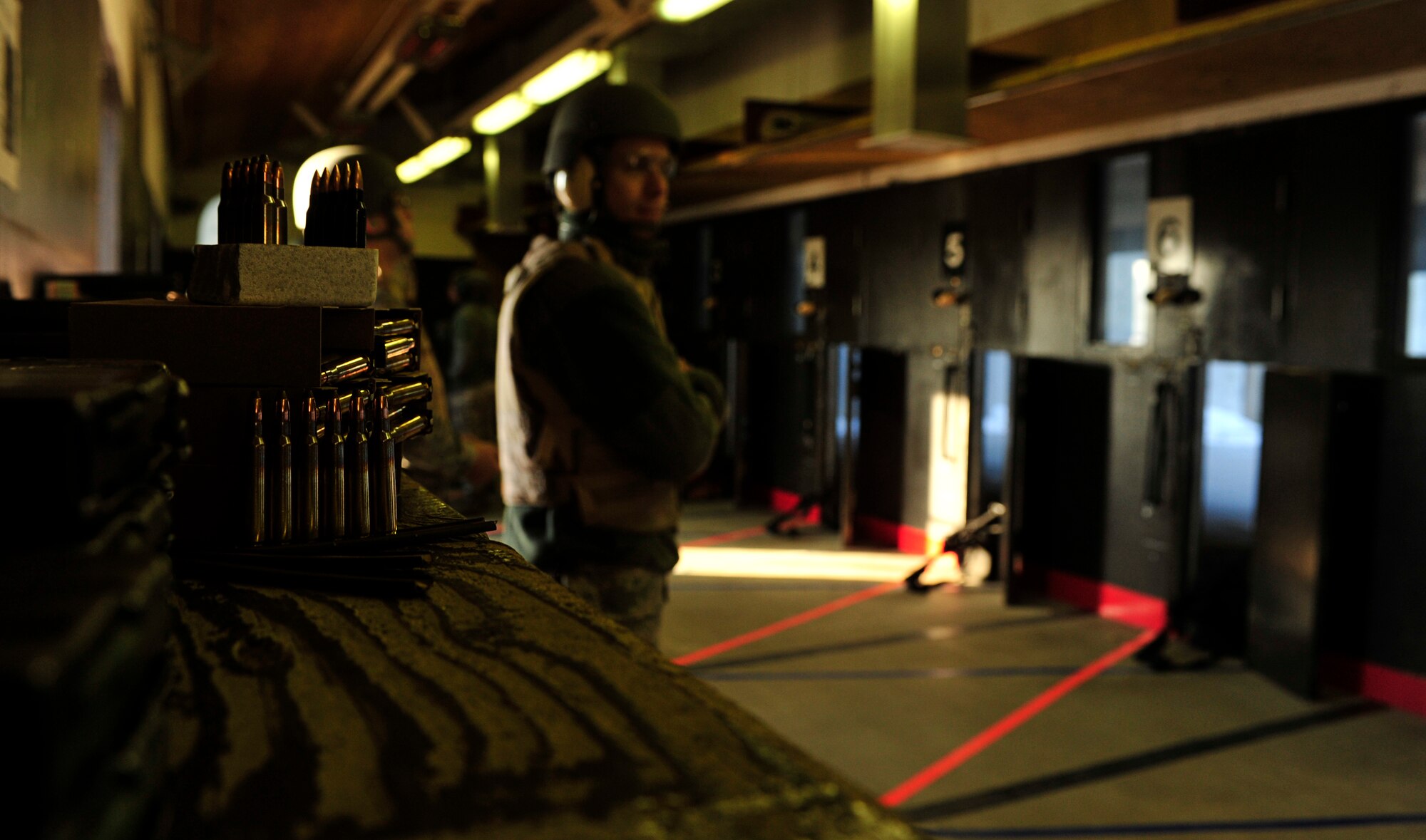MINOT AIR FORCE BASE, N.D. –  Personnel from various squadrons train to qualify at Combat Arms Training and Maintenance here, Dec. 8. CATM instructors are security forces personnel who train military members on weapon use. They also maintain and repair weapons in the security forces inventory. (U.S. Air Force photo/Senior Airman Desiree Esposito) 


