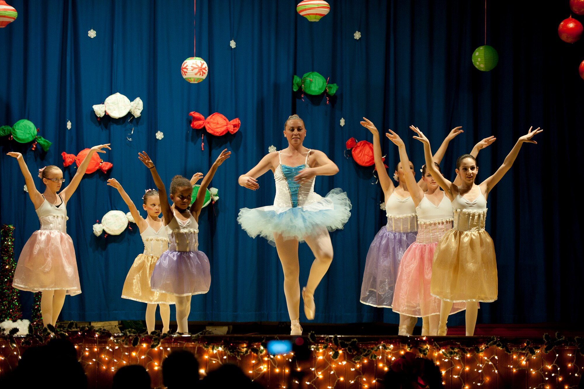 Members of the Youth Dance Program perform during the Nutcracker "Sweet" Dance Show Dec. 10, 2011, in the Incirlik Unit School cafeteria at Incirlik Air Base, Turkey. The performers put on two shows and danced to classical Christmas music along with holiday jazz and hip-hop. (U.S. Air Force photo by Senior Airman Clayton Lenhardt/Released) 