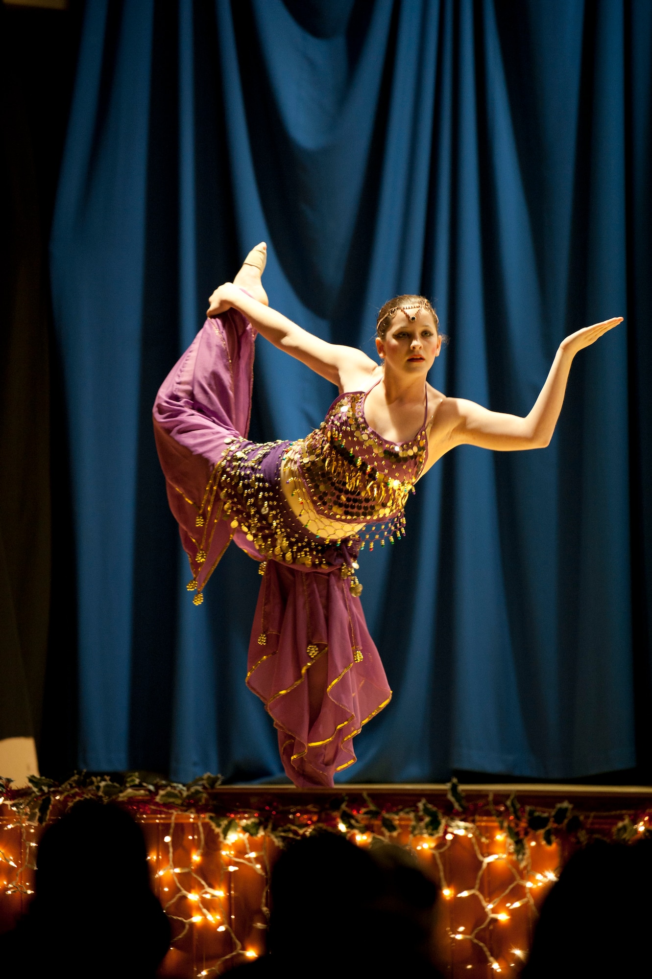 A member of the Youth Dance Program performs during the Nutcracker "Sweet" Dance Show Dec. 10, 2011, in the Incirlik Unit School cafeteria at Incirlik Air Base, Turkey. The performers put on two shows and danced to classical Christmas music along with holiday jazz and hip-hop. (U.S. Air Force photo by Senior Airman Clayton Lenhardt/Released) 