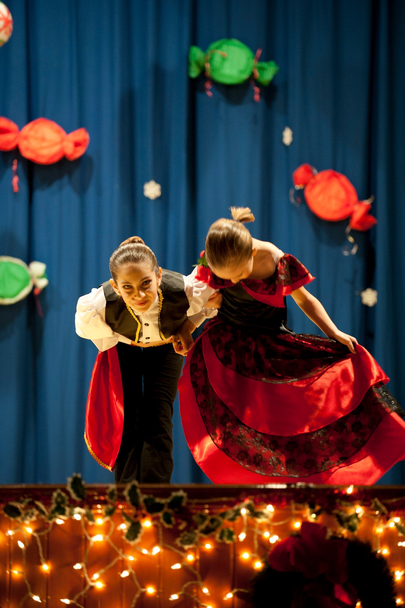 Members of the Youth Dance Program bow after a performance during the Nutcracker "Sweet" Dance Show Dec. 10, 2011, in the Incirlik Unit School cafeteria at Incirlik Air Base, Turkey. The performers put on two shows and danced to classical Christmas music along with holiday jazz and hip-hop. (U.S. Air Force photo by Senior Airman Clayton Lenhardt/Released) 