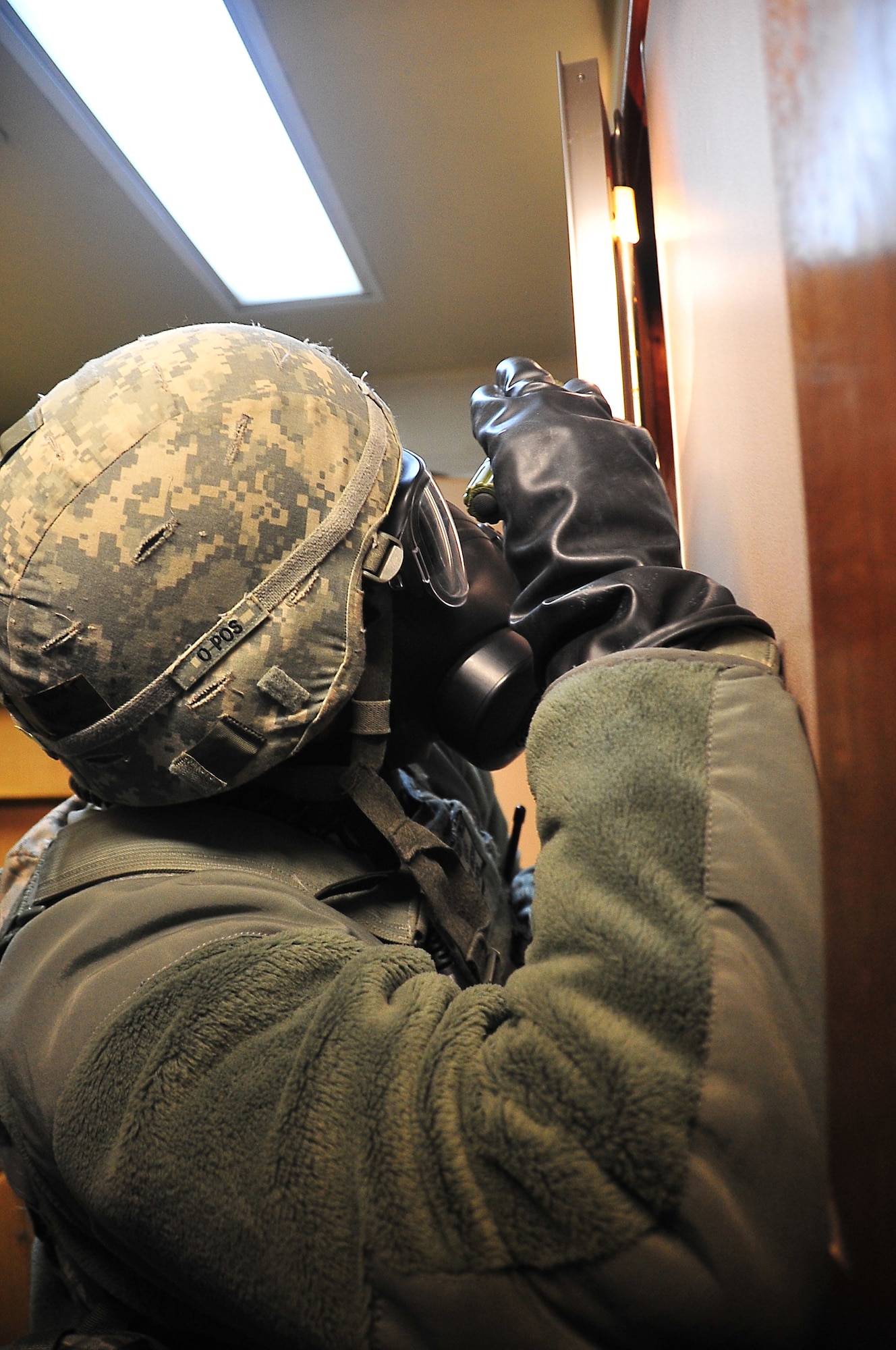 51st Security Forces Squadron, Tech Sgt. Watson searches the closet, during an Emergency Management Exercise.  Osan responders reacted to suspicious bomb making materials with foreign markings, found during a dorm inspection, here, Dec. 12, 2011.  The dorm was evacuated and occupants were sent to the Emergency room for screening.  The exercise gave Osan responders a chance to shine while responding to a very possible scenario.  (U.S. Air Force photo/Staff Sgt. Daylena Gonzalez)