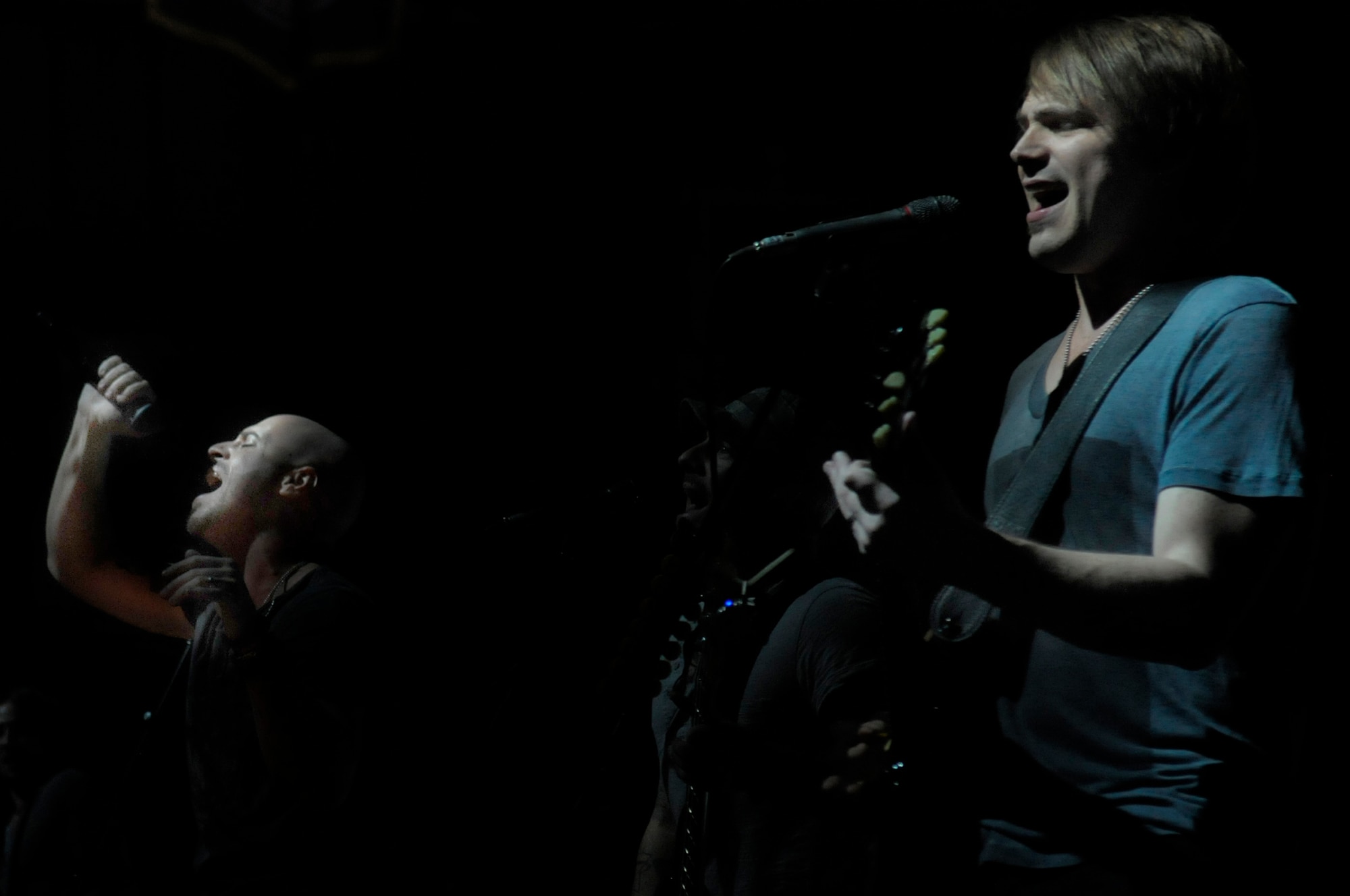 Chris Daughtry belts out lyrics to "Feels Like Tonight" with guitarist Brian Craddock during a concert in Hangar 1 at Ramstein Air Base, Germany, Dec. 10, 2011. The rock band Daughtry, comedian Gabriel "Fluffy" Iglesias and the Band of the U.S. Air Force Reserve performed during a concert for more than 4,000 service members. The performers finished out their 13-day tour at Ramstein. Their six concerts took them through Southwest Asia and Europe to bring entertainment to American troops and their families as part of the Operation Seasons Greetings - Tour for the Troops 2011. (U.S. Air Force photo by Staff Sgt. Travis Edwards)