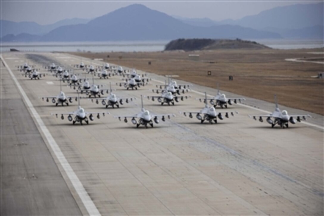 F-16 Fighting Falcons from both the 8th and 419th Fighter Wings demonstrate an "elephant walk" formation as they taxi down a runway during an exercise at Kunsan Air Base, South Korea, on Dec. 2, 2011.  The exercise showcased Kunsan AB aircrews' capability to quickly and safely prepare an aircraft for a wartime mission.  