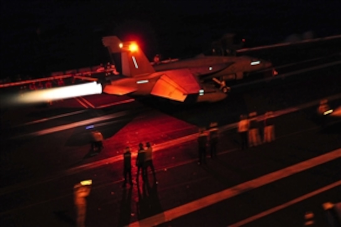 An F/A-18F Super Hornet launches from the flight deck of the Nimitz-class aircraft carrier USS Carl Vinson under way in the Pacific Ocean, Dec. 10, 2011.