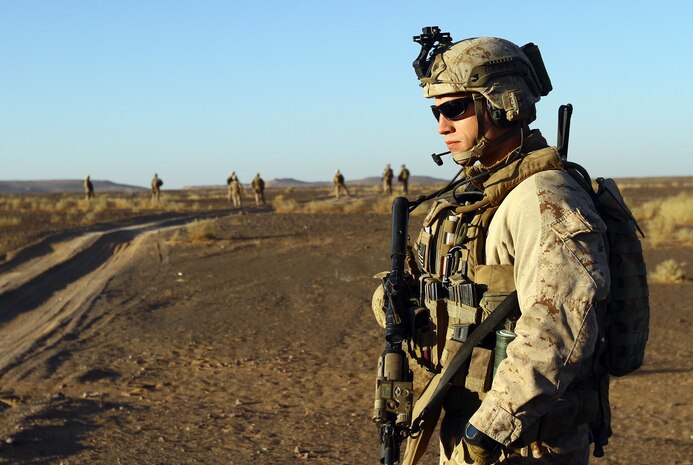 U.S. Marine Capt. Stephen Bartoszak, Charlie Company, 1/25 executive officer and 27-year-old native of Centereach, N.Y., posts security during an air interdiction force mission here, Dec. 7. The AIF mission was conducted in support of an Afghan Border Police led clearing operation in Khan-Neshin. During the mission Marines and sailors from Charlie Co., 1/25, and 2nd Bn., 11th Marines, circled above, searching for suspicious vehicles or personnel. The AIF plays a unique role with Regimental Combat Team 5’s counter-insurgency operations in southern Helmand.