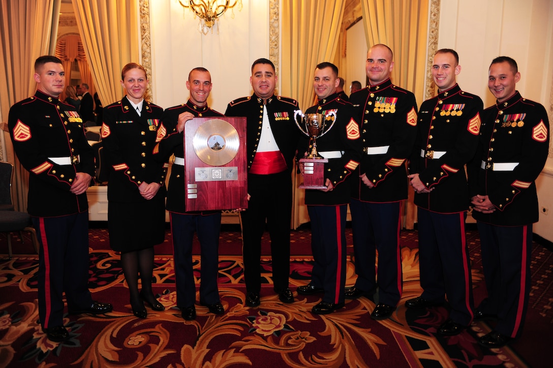 The Marine Corps Logistics Base Albany band poses with their Band of the Year Award during an awards banquet at the Hilton Chicago, Dec. 13. The awards banquet was held during the Marine Corps Music fields annual leadership symposium Dec. 12-14.
