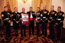 The Marine Corps Logistics Base Albany band poses with their Band of the Year Award during an awards banquet at the Hilton Chicago, Dec. 13. The awards banquet was held during the Marine Corps Music fields annual leadership symposium Dec. 12-14.