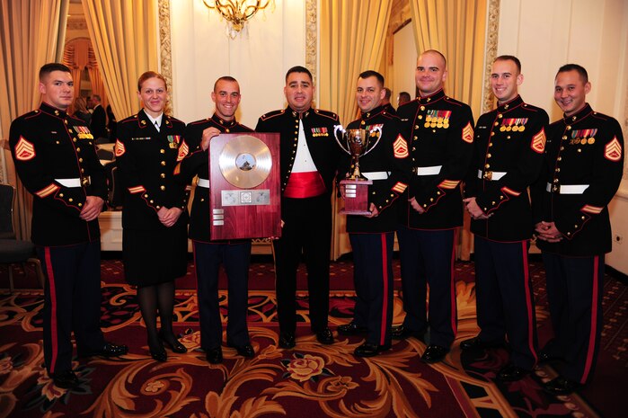 The Marine Corps Logistics Base Albany band poses with their Band of the Year Award during an awards banquet at the Hilton Chicago, Dec. 13. The awards banquet was held during the Marine Corps Music fields annual leadership symposium Dec. 12-14.