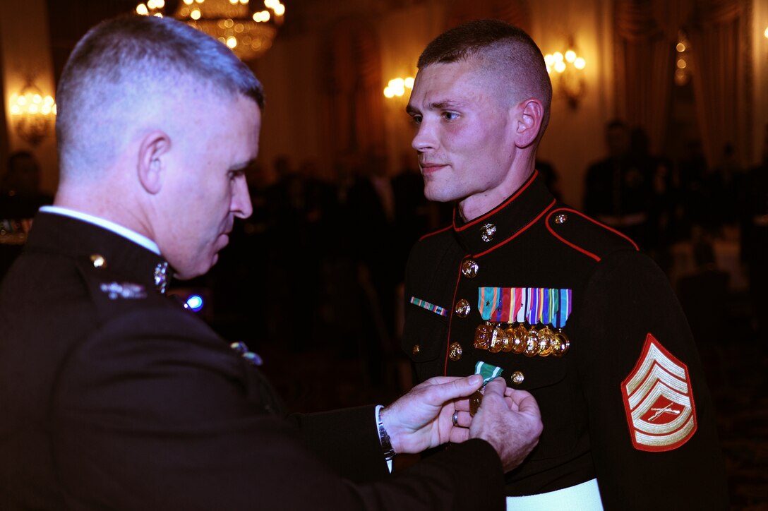 Gunnery Sgt. Jonathan Bley, small ensemble leader with the Marine Corps Recruiting Depot San Diego Band, receives a Navy and Marine Corps Commendation Medal after receiving the Staff Noncommissioned Officer Marine Musician of the Year award, Dec. 13. The awards banquet was held at the Hilton Chicago.