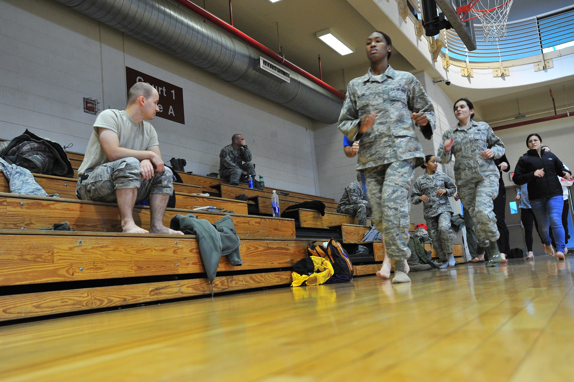 Staff Sgt. Keneka Wallace, 51st Aerospace Medical Squadron diet therapy technician, participates in a one-day lecture and clinichosted by the Osan Fitness Center Dec. 8, 2011. Ashish Mukharji spoke to approximately 20 Airmen on proper running technique as well as injury prevention. (U.S. Air Force photo/ Daylena Gonzalez)