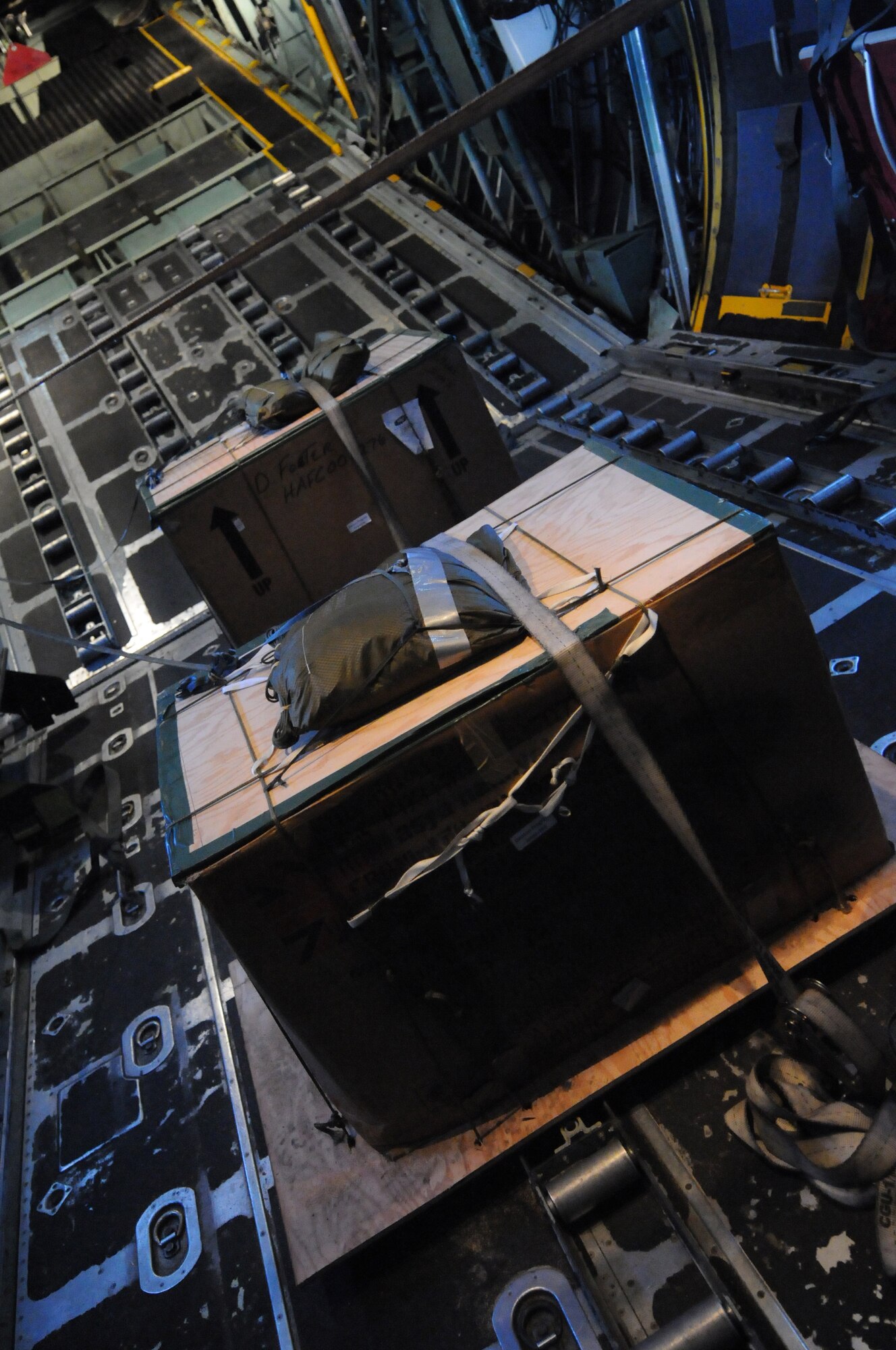 ANDERSEN AIR FORCE BASE, Guam - Two pallets are strapped in to the C-130 and will be air dropped over Fais and Ngulu , two islands in the Micronesian Islands, Dec. 12. OCD will deliver care packages to more than 50 islands within Micronesian States during the next two weeks. (U.S. Air Force photo/Senior Airman Carlin Leslie)