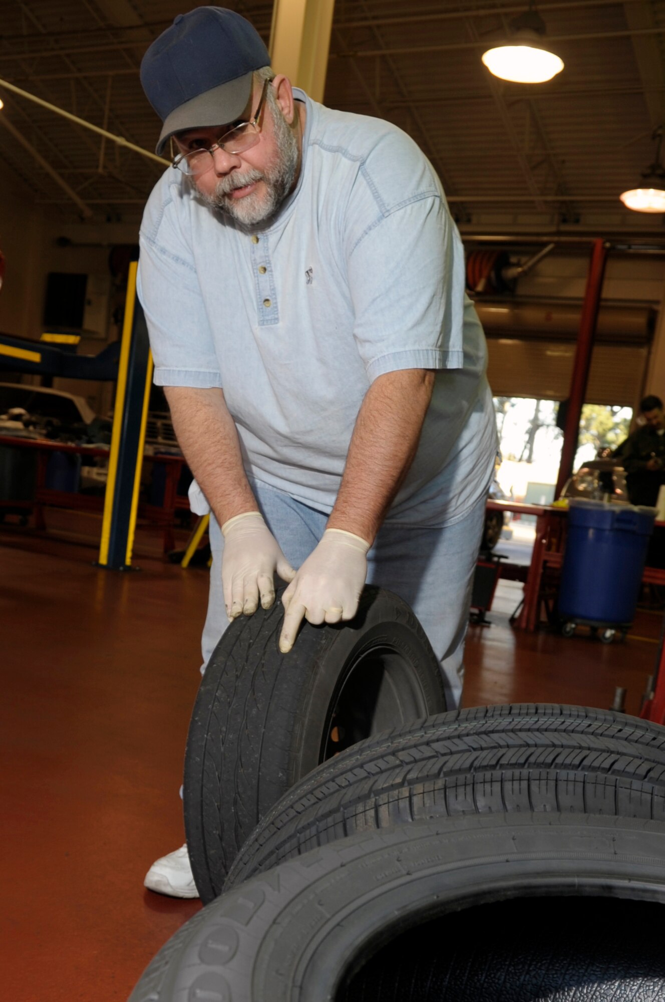 VANDENBERG AIR FORCE BASE, Calif. -- Eric Whittaker, a United Paradine contractor, shows us bad tread wear while changing tires at the auto hobby shop here Friday, Dec. 9, 2011. The auto hobby shop is open to customers with base access offering a variety of services and a knowledgeable staff to help with automotive projects.
(U.S. Air Force photo/Jerry E. Clemens Jr.)