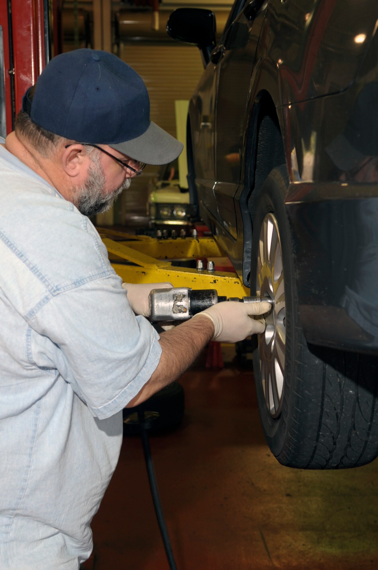 VANDENBERG AIR FORCE BASE, Calif. -- Eric Whittaker, a United Paradine contractor, uses an air tool to change a tire at the auto hobby shop here Friday, Dec. 9, 2011. The auto hobby shop is open to customers with base access offering a variety of services and a knowledgeable staff to help with automotive projects.
(U.S. Air Force photo/Jerry E. Clemens Jr.)