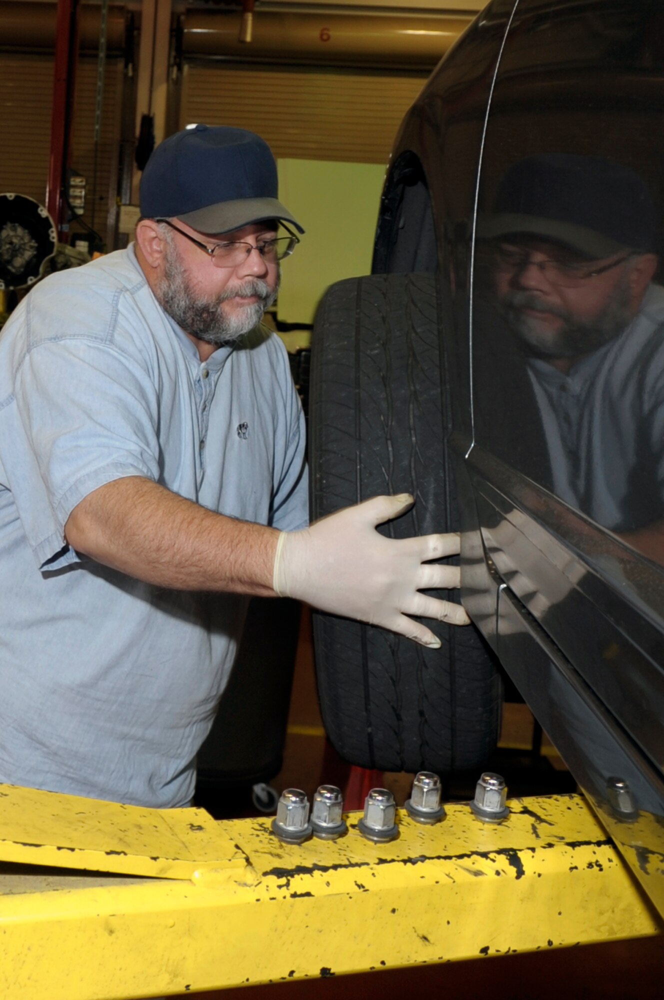 VANDENBERG AIR FORCE BASE, Calif. -- Eric Whittaker, a United Paradine contractor, changes a tire at the auto hobby shop here Friday, Dec. 9, 2011. The auto hobby shop is open to customers with base access offering a variety of services and a knowledgeable staff to help with automotive projects.
(U.S. Air Force photo/Jerry E. Clemens Jr.)