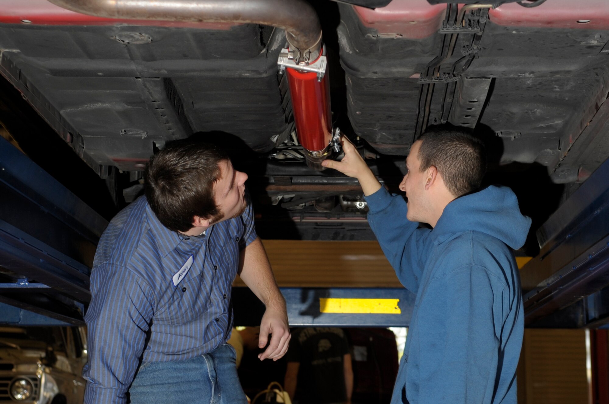 VANDENBERG AIR FORCE BASE, Calif. -- Aaron Moreheart, an automotive specialist, and 2nd Lt. Julian Vaiana, 30th Civil Engineer Squadron, prepare the exhaust pipe on Vaianas car for welding here Friday, Dec. 9, 2011. The auto hobby shop is open to customers with base access offering a variety of services and a knowledgeable staff to help with automotive projects.
(U.S. Air Force photo/Jerry E. Clemens Jr.)