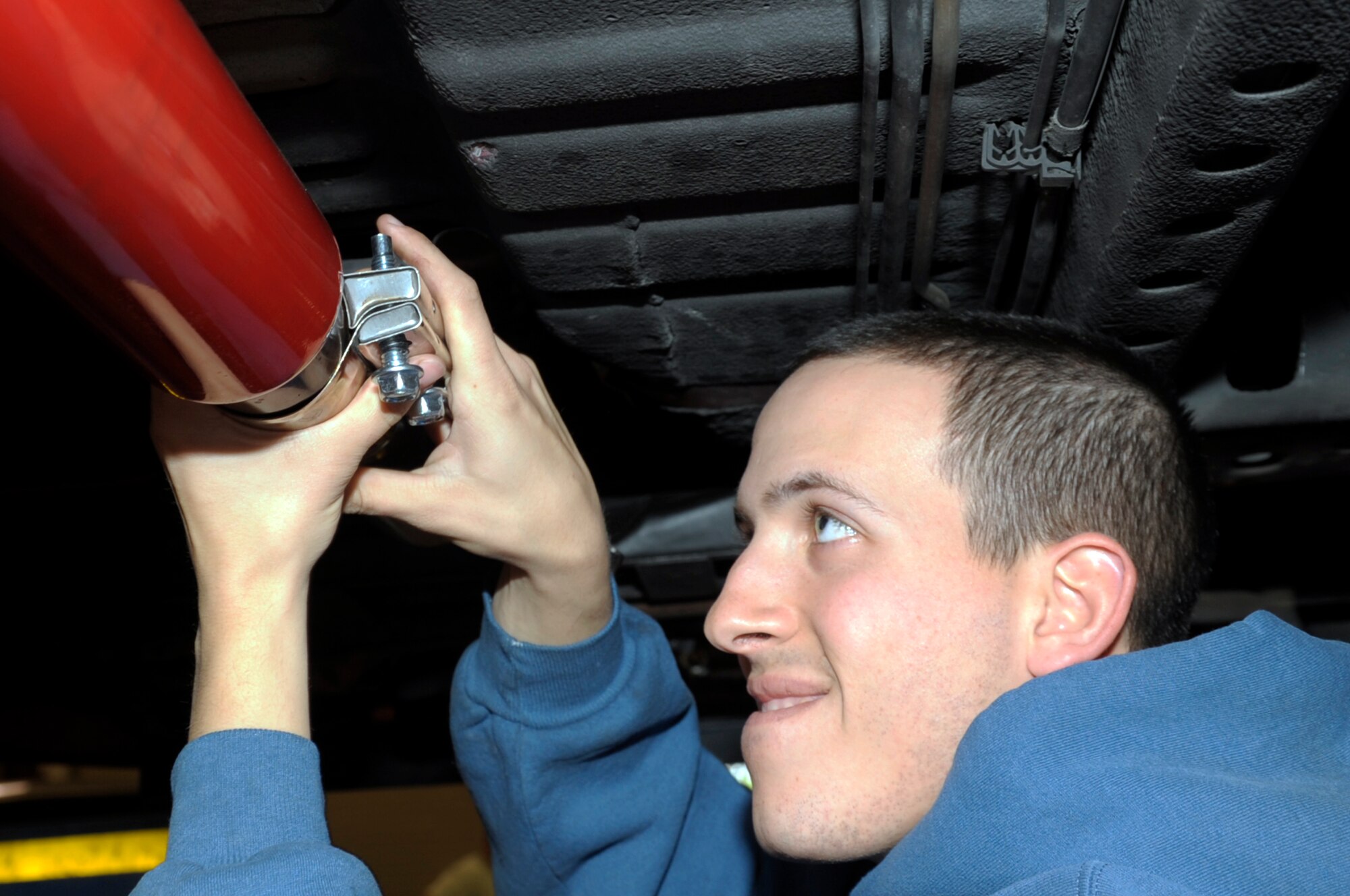 VANDENBERG AIR FORCE BASE, Calif. -- 2nd Lt. Julian Vaiana, a 30th Civil Engineer Squadron energy manager, prepares the exhaust pipe on his car for welding here Friday, Dec. 9, 2011. The auto hobby shop is open to customers with base access offering a variety of services and a knowledgeable staff to help with automotive projects. 
(U.S. Air Force photo/Jerry E. Clemens Jr.)
