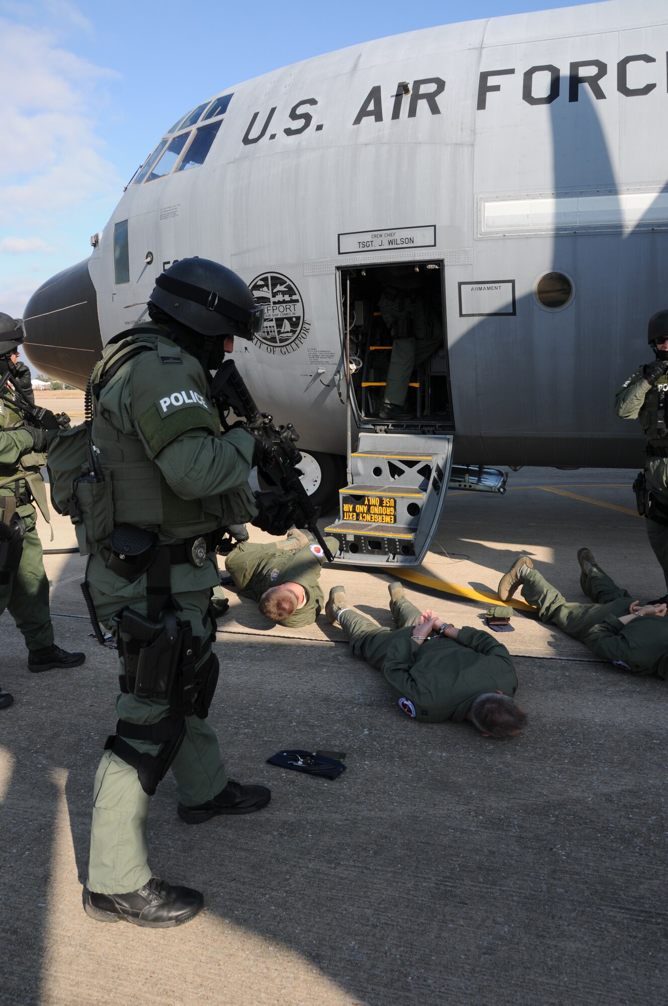 During an anti-hijacking exercise on the flightline at Keesler Air Force Base, Miss., Dec. 12, 2011, Biloxi Police Department Special Response Team secures the aircraft and its passengers during the “assault.”  (U.S. Air Force photo by Kemberly Groue)