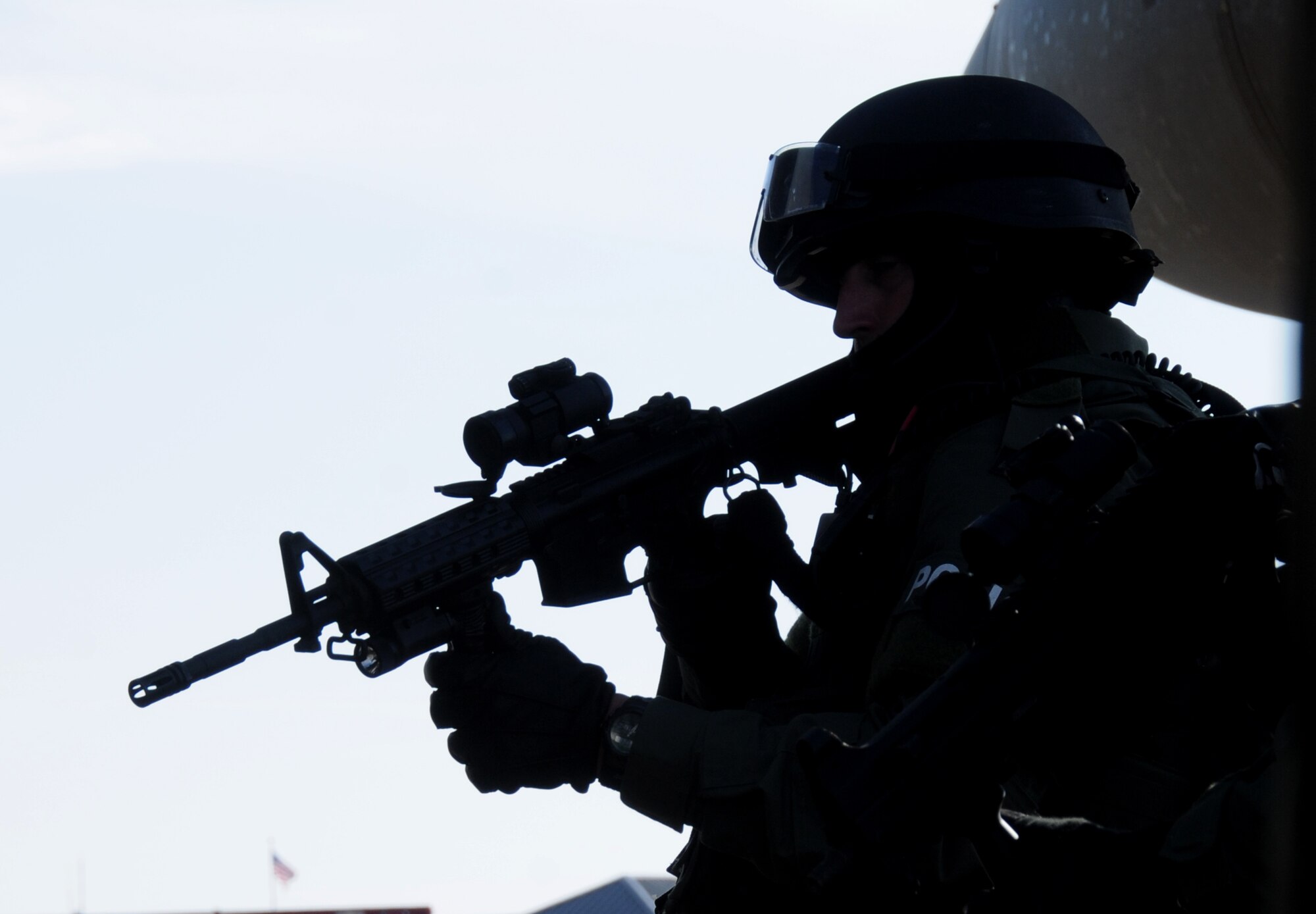 During an anti-hijacking exercise on the flightline at Keesler Air Force Base, Miss., Dec. 12, 2011, Biloxi Police Department Special Response Team member holds his post as his team secures the aircraft and its passengers during the “assault.”  (U.S. Air Force photo by Kemberly Groue)