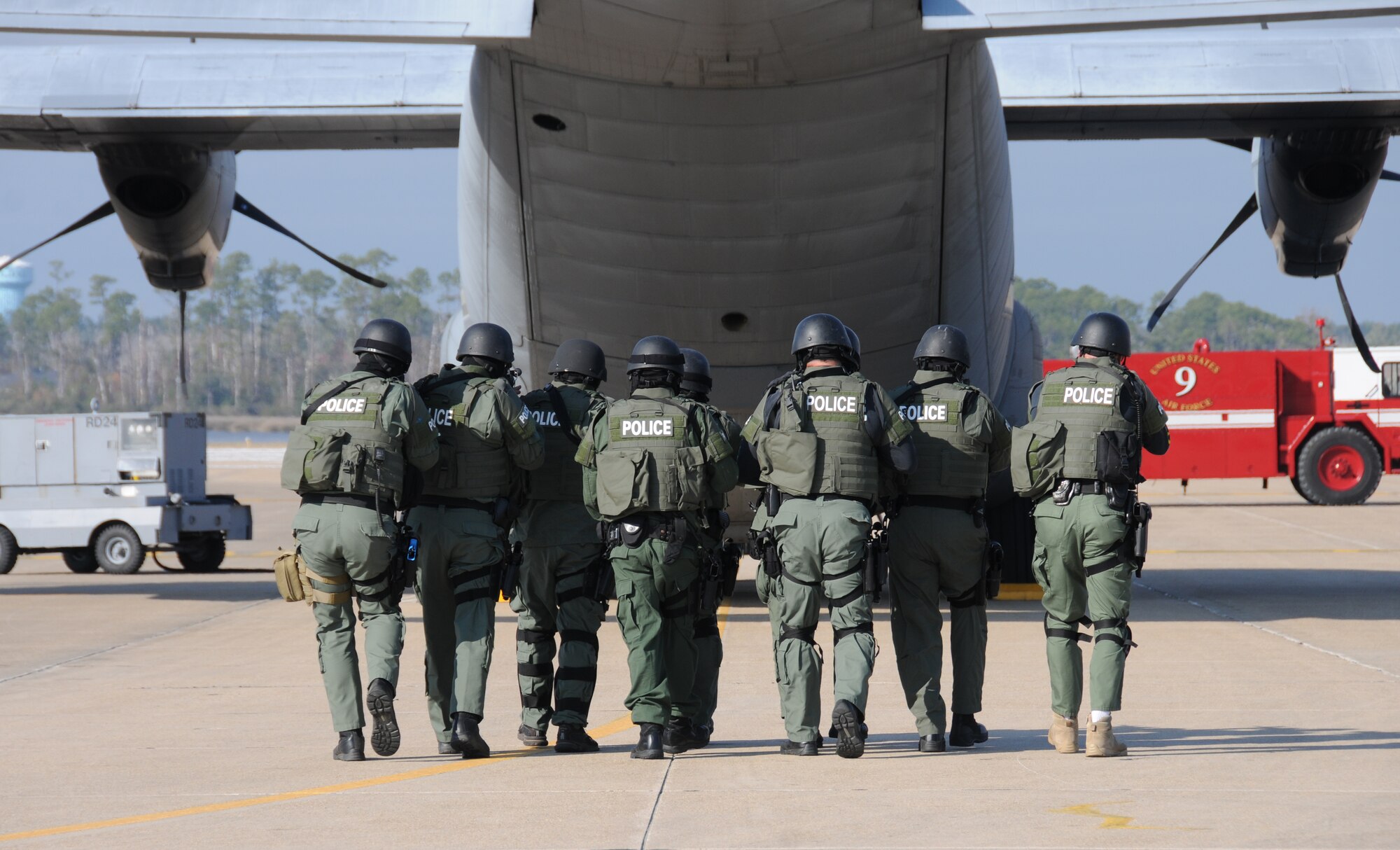 During an anti-hijacking exercise on the flightline at Keesler Air Force Base, Miss., Dec. 12, 2011, the Biloxi Police Department Special Response Team approach the C-130 aircraft in attempt to secure the plane after being “hijacked.”  (U.S. Air Force photo by Kemberly Groue)