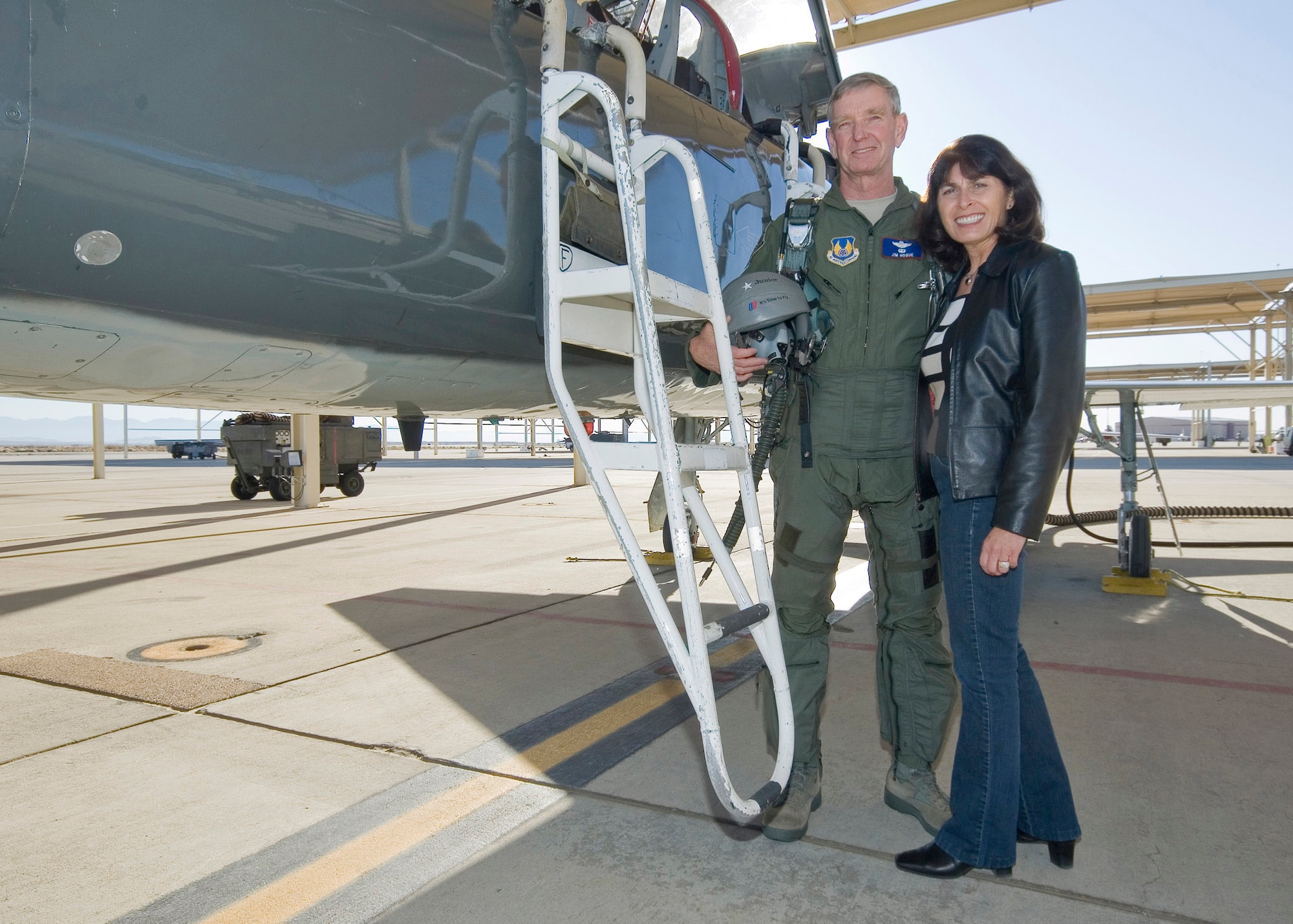 Brig. Gen. James R. Hogue and his wife Paula celebrate his 36 year career with a fini-flight at Edwards AFB here.  The mobilization assistant to the commander, Air Force Flight Test Center, retired from United States Air Force Reserve Command on Dec. 9. (U.S. Air Force Photo by Rob Densmore)