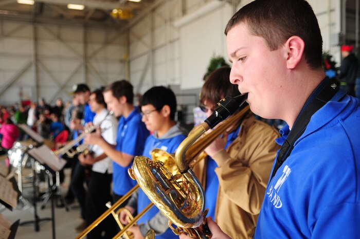A member of the Wheatland High School Band plays during the Children's Holiday Party Dec. 10 at Dock 6, Beale AFB, Calif. Attendees participated in crafts, face painting, free food and presents. (U.S. Air Force photo by Senior Airman Shawn Nickel/Released)