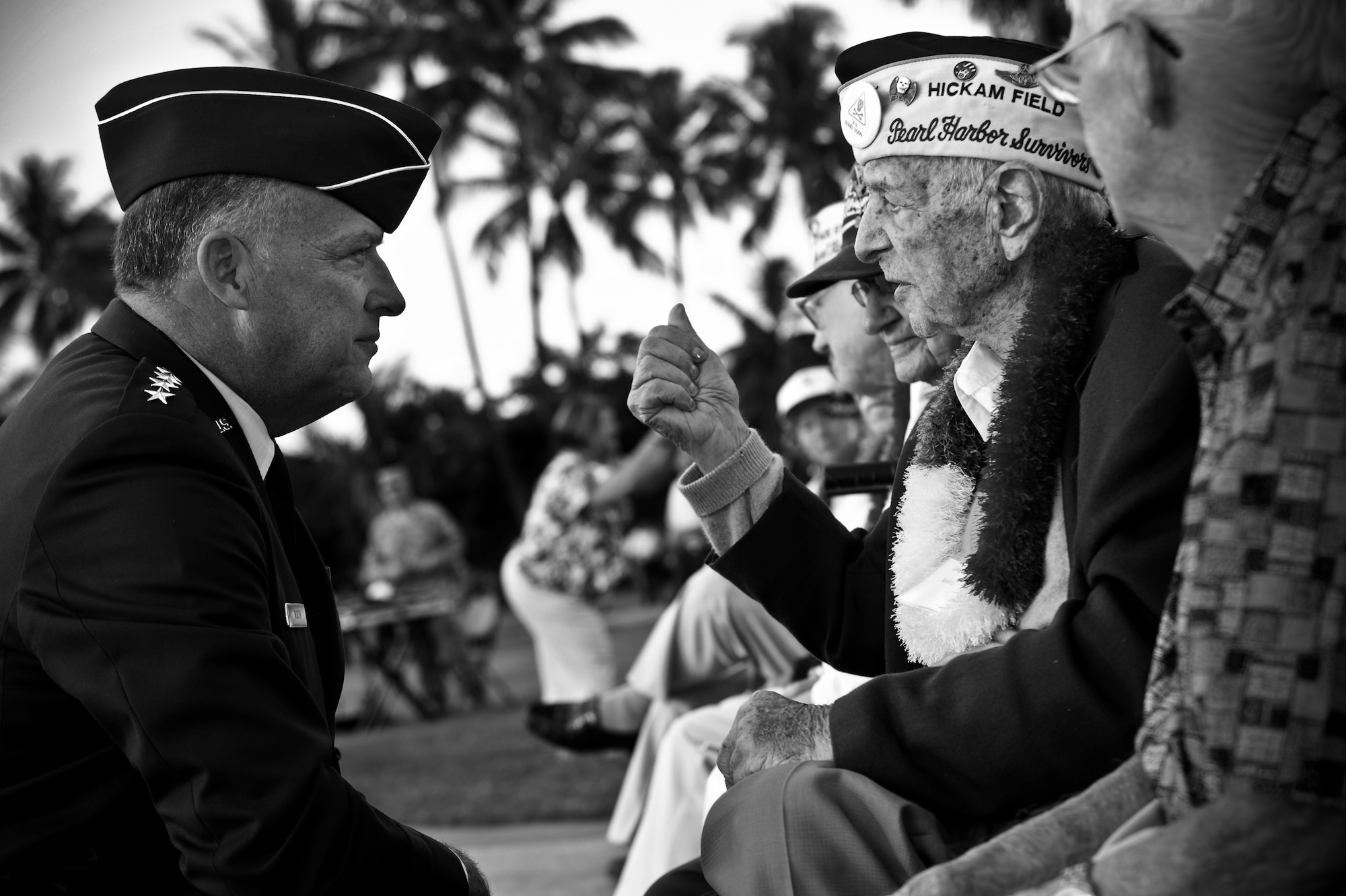 Gen. Gary North, Pacific Air Forces commander, speaks with Lou Roffman, a Hickam Field survivor of the Dec. 7, 1941 attacks on Oahu, at the 70th Anniversary Remembrance Ceremony at Joint Base Pearl Harbor-Hickam, Hawaii, Dec. 7, 2011.  Roffman told his story about the attacks 70 years ago, reminiscing about his time at Hickam Field. (U.S. Air Force photo/Senior Airman Lauren Main/Released)