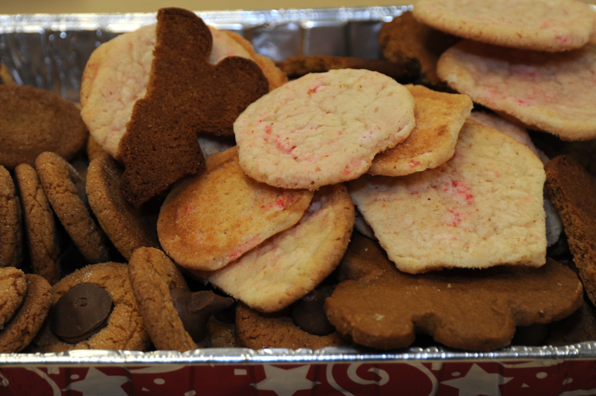 Cookies sit in a tray prior to being packaged at the Hurlburt Field Chapel, Dec. 12, 2011.  There were more than 10,000 cookies packaged and delivered to Hurlburt Field Airmen living in the dorms. (U.S. Air Force photo/Airman 1st Class Naomi M. Griego)(Released)