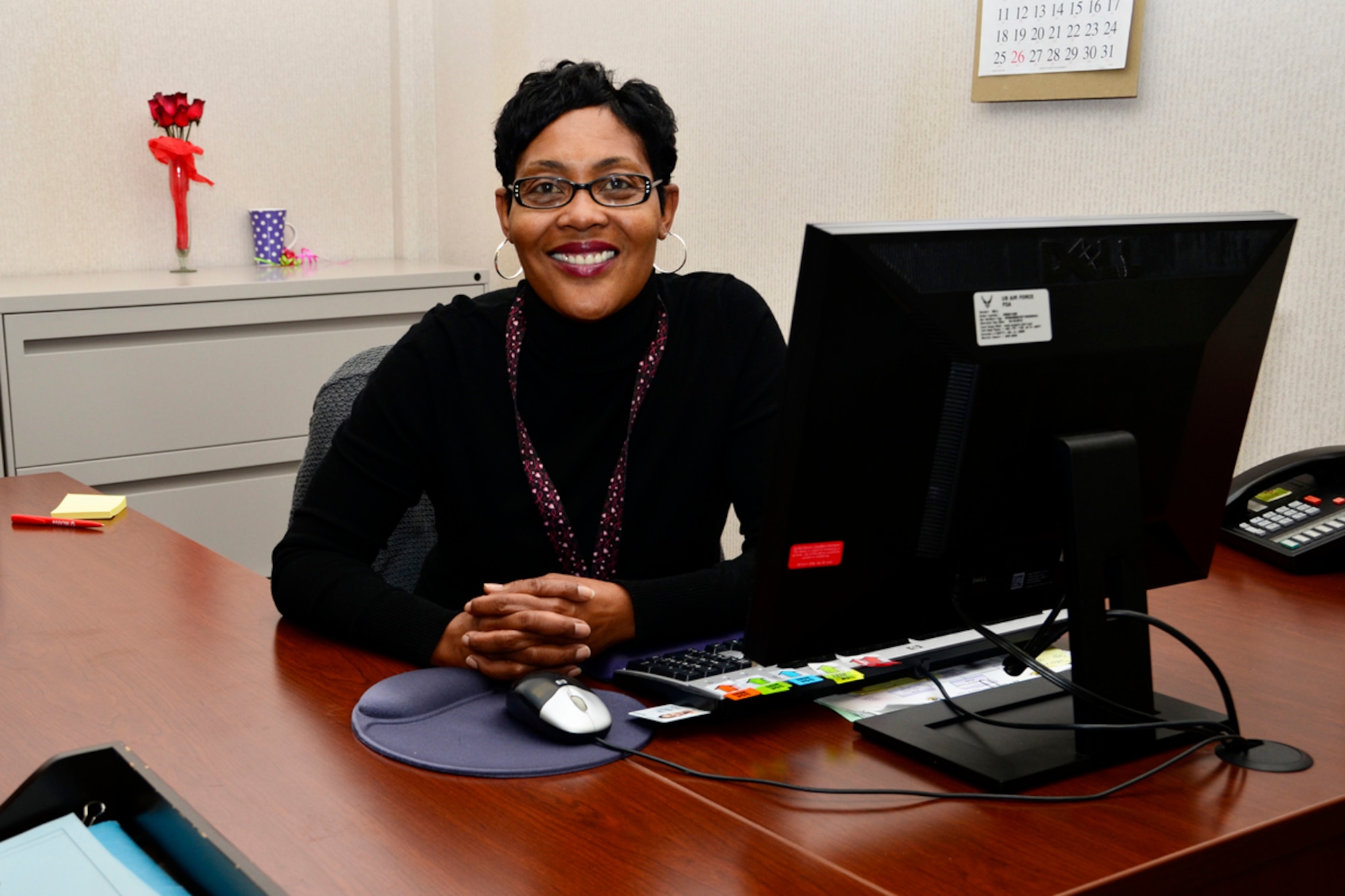 Lena (Mae) Ledford is the administative assistant for the 94th Communications Flight, Dobbins Air Reserve Base, Ga. Her duties include monitoring 225 base telephone lines, overseeing the base cellular phone accounts, scheduling video teleconferences and processing Dobbins' Defense Automated Printing Service orders. (U.S. Air Force photo/Senior Airman Christina Bozeman)
