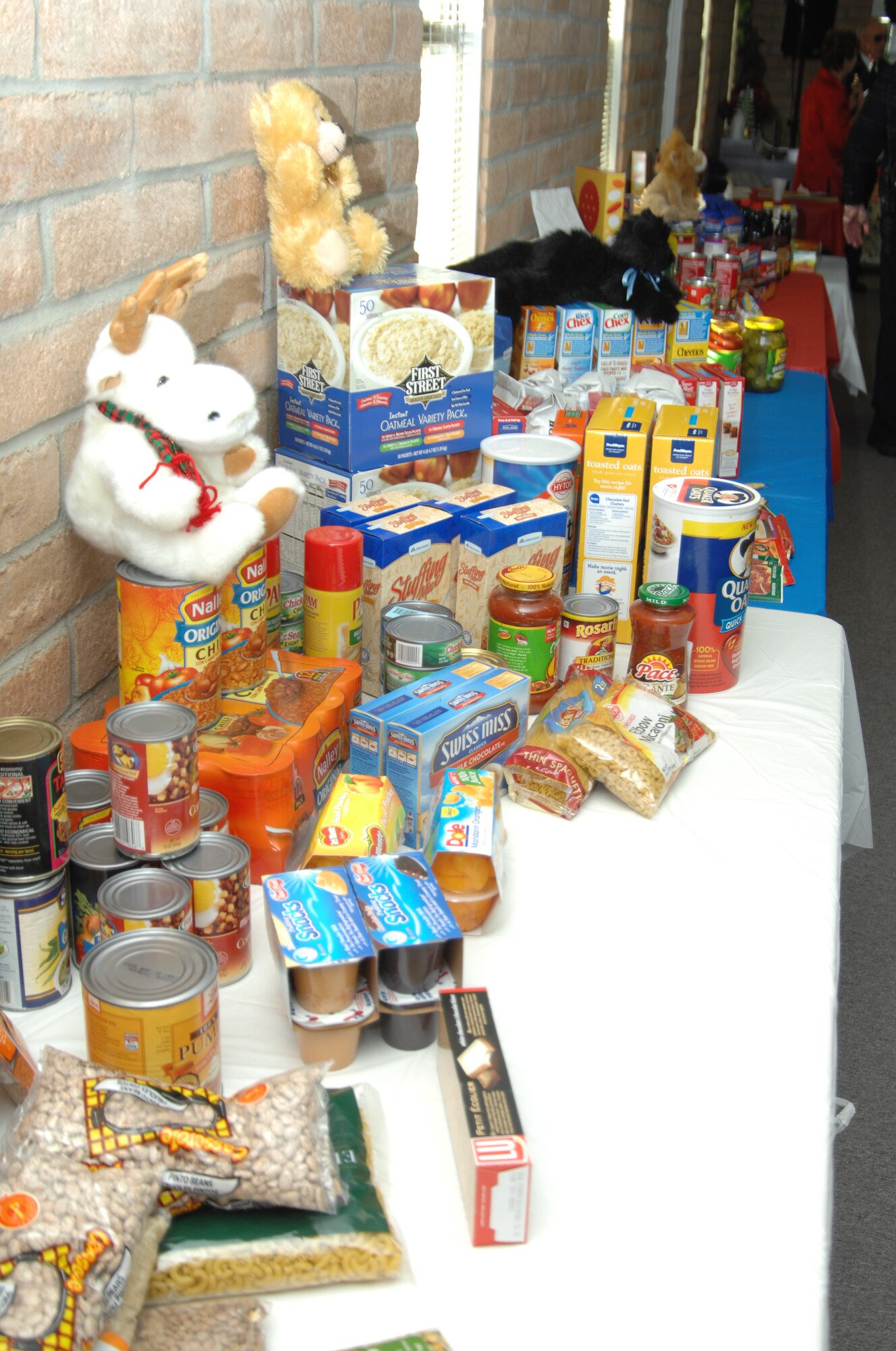 Numerous food items line a table at Silvercrest II Estates retirement community Dec.10, 2011 in Nampa, Idaho. The community donated approximately 1,000 pounds of food to Mountain Home Air Force Base through the Operation Warmheart food locker. (U.S. Air Force photo by Senior Airman Benjamin Sutton)
