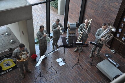 Members of the Air Force Heritage Band play their instruments on tour of Joint Base Charleston  -Air Base Dec. 9. The AF Heritage Band toured JB Charleston to spread holiday cheer with playing Christmas carols. (U.S. Air Force photo/Lt. Leah Davis)