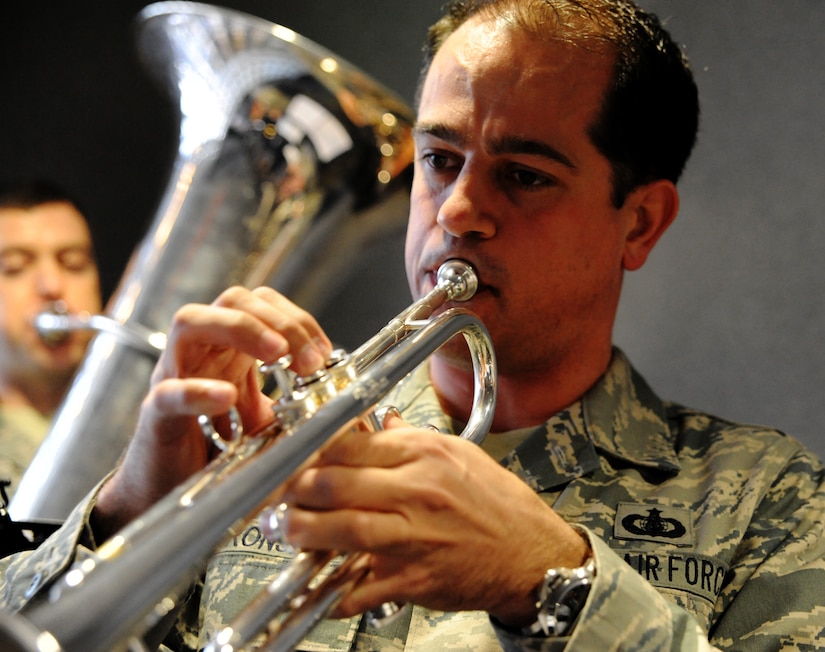 Staff Sgt. Chris Cronsell plays the trumpet at Joint Base Charleston - Air Base Dec. 9. The Air Force Heritage Band toured JB Charleston to spread holiday cheer by playing traditional Christmas carols. (U.S. Air Force photo/Airmen 1st Class Ashlee Galloway)
