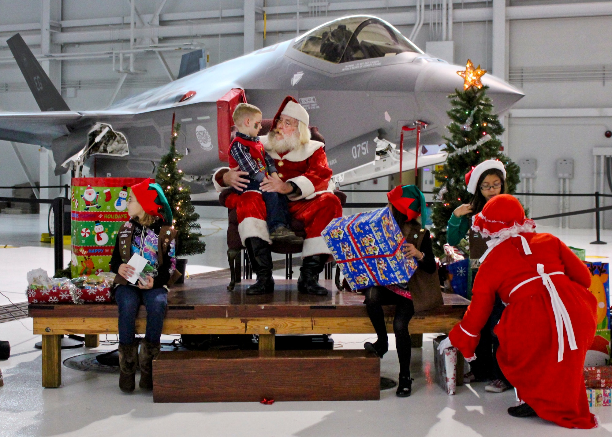 About 240 military and civilian parents from the Navy, Marine Corps and Air Force and their children from across the 33d Fighter Wing gathered for the wing's children’s Christmas party Dec. 10 at Eglin Air Force Base, Fla.  (U.S. Air Force photo/Dianne Bitzes)
