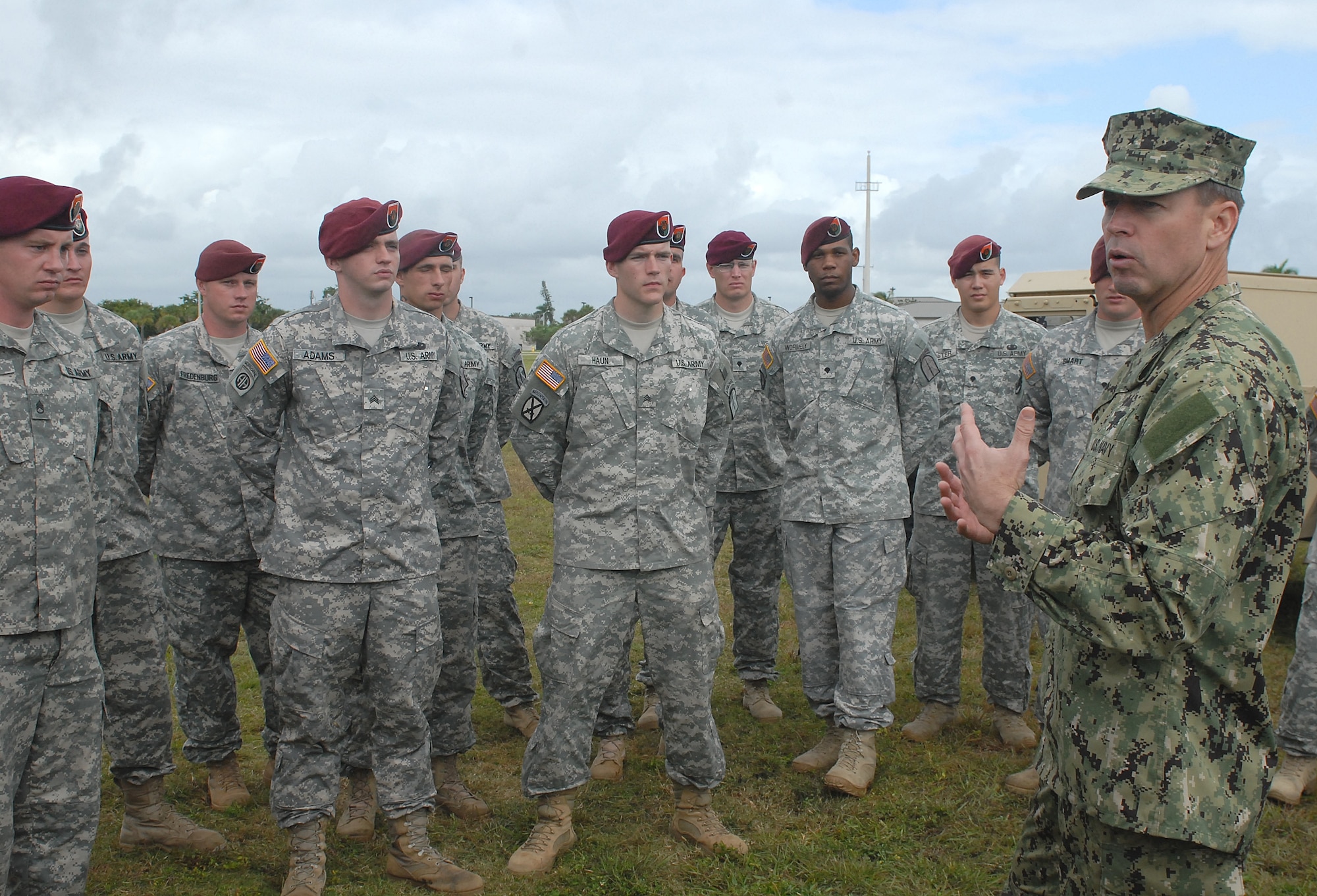 Navy Rear Adm. Thomas L. Brown II (right), commander of Special Operations Command South, talks to Soldiers assigned to the 112th Signal Detachment following the change-of-command ceremony Dec. 9 at Homestead Air Reserve Base, Fla. During his remarks, the SOCSOUTH commander thanked the 112th Soldiers for their hard work in building partner nation capacity on the use of military communications equipment to foreign forces all across the U.S. Southern Command area of responsibility, which spans from the Caribbean, Central and South America. 
(Department of Defense photo by Sgt. 1st Class Alex Licea, Special Operations Command South Public Affairs)
