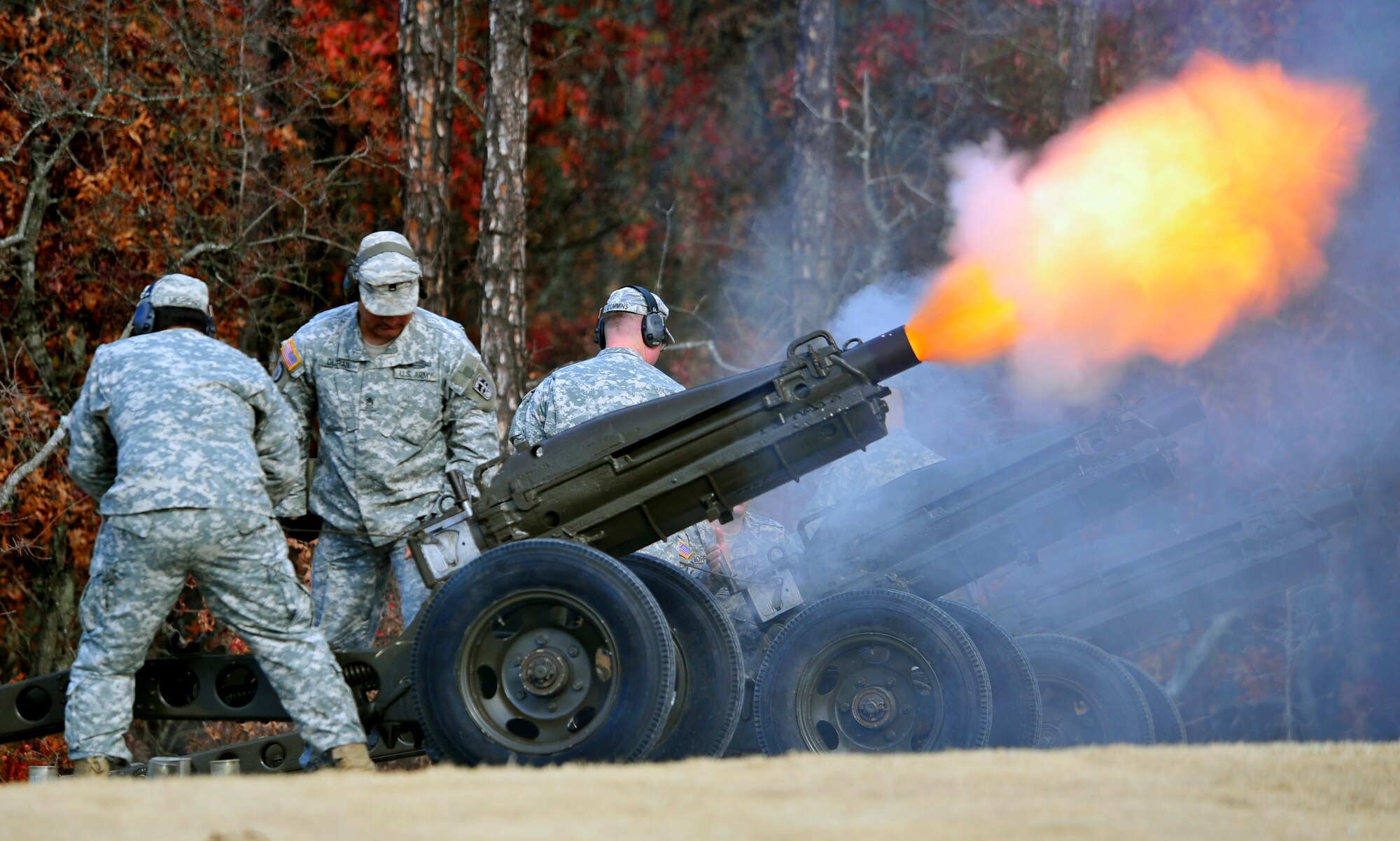 U.S. Army Soldiers from Fort Jackson, S.C. fire cannon for a 21-gun salute during the Wreaths Across America ceremony at Fort Jackson National Cemetery, Columbia, S.C., Dec. 10, 2011. Wreaths Across America occurs the second Saturday of December every year. People gather to lay holiday wreaths on the gravestones at national military cemeteries. (U.S. Air Force photo/Senior Airman Daniel Phelps/Released)