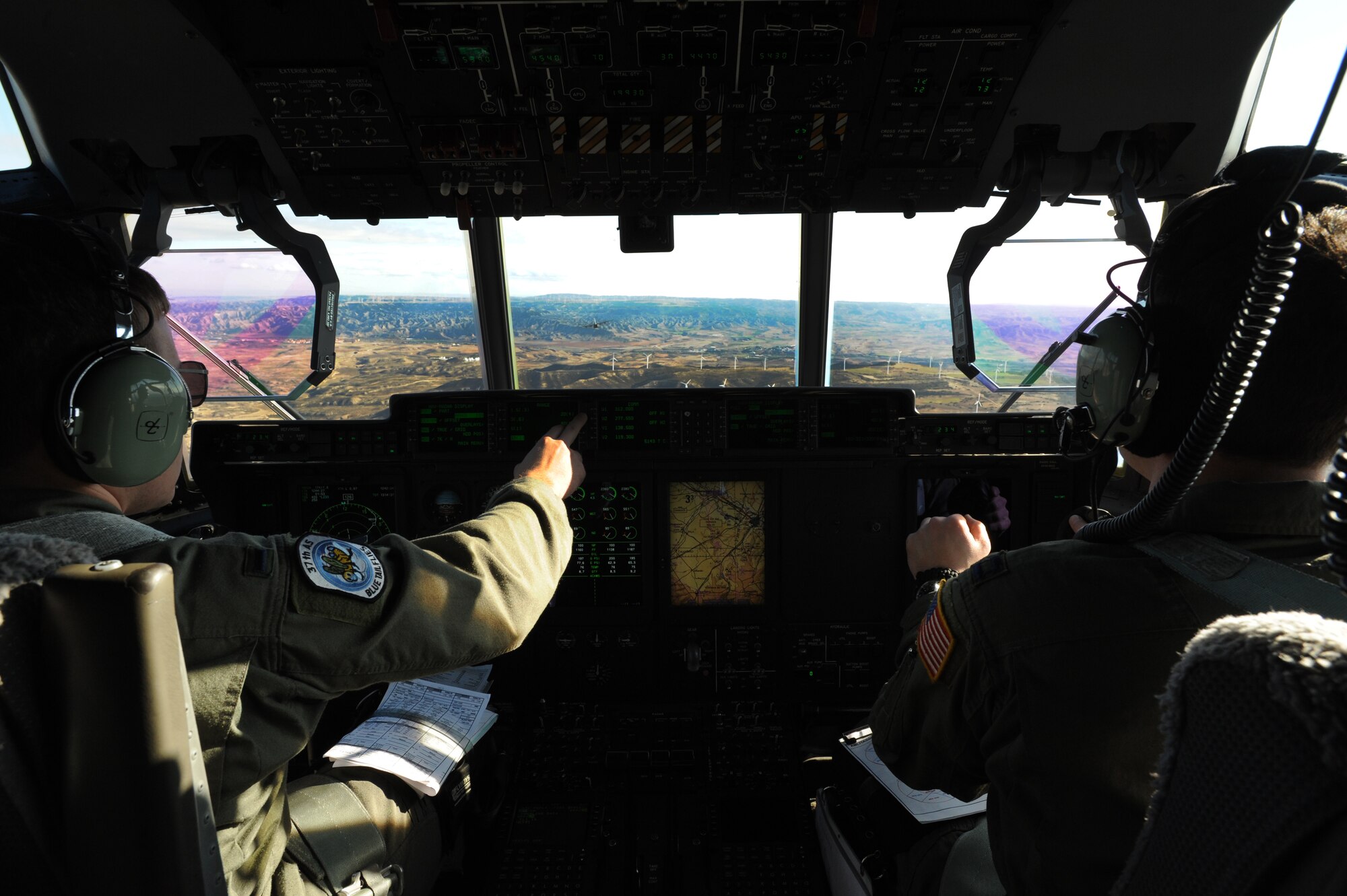 Capt. Bryan Lucas and 1st Lt. Christopher Carlen navagate a C-130J Super Hercules during an off-station training in Zaragoza, Spain., Dec. 12, 2011. The OST consisted of a 90 member team and two aircraft, all assembled to enhance interoperability between U.S. and Spanish air forces as well as build partnerships between the two countries.  (U.S. Air Force photo by Airman 1st Class Caitlin O'Neil-McKeown)