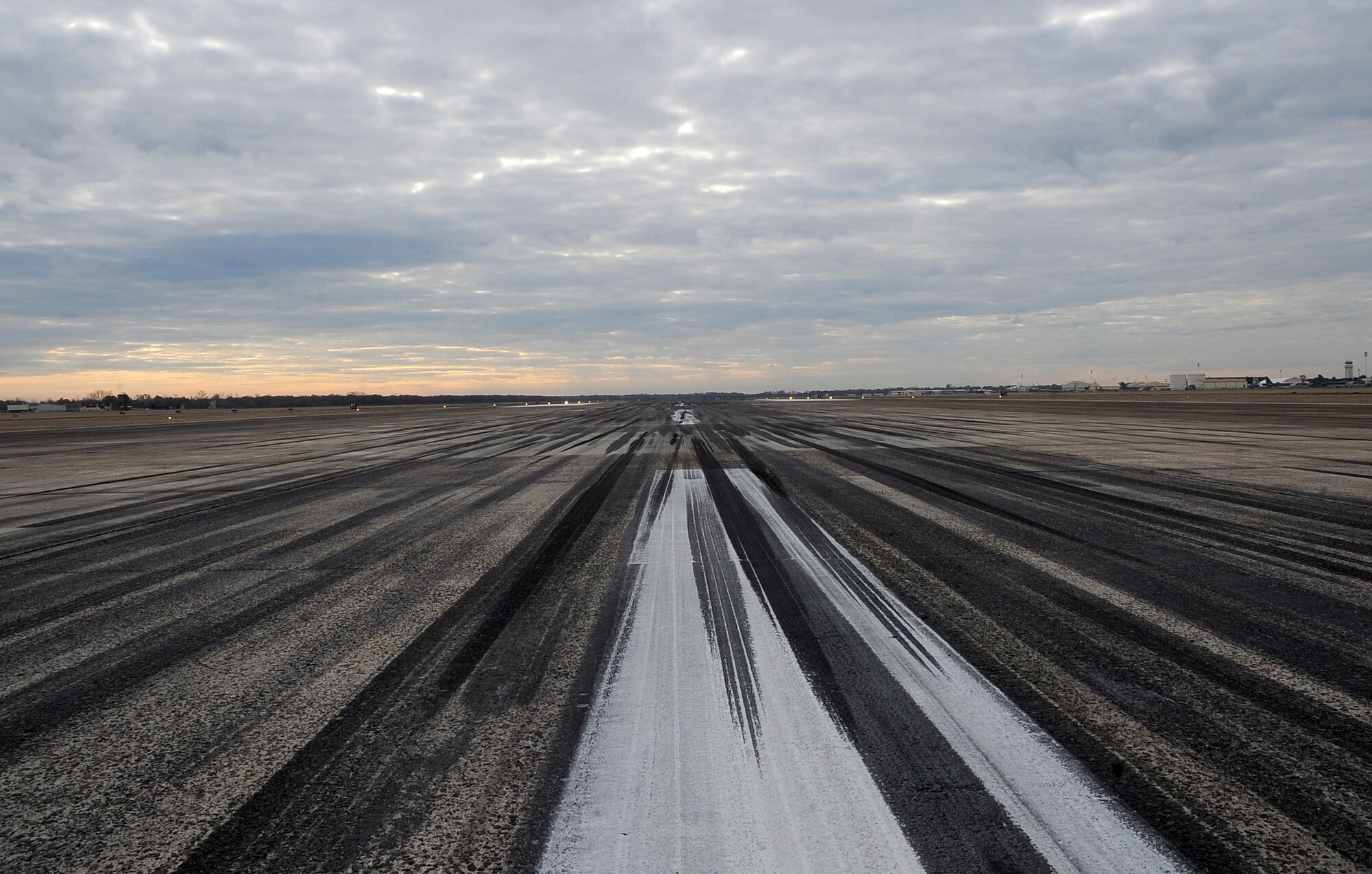 The runway sits momentarily empty Dec. 12 on Barksdale Air Force Base, La. Over time, rubber build-up from aircraft landings and take-offs can damage the runway and cover the centerline, which prevents pilots from accurately landing. (U.S. Air Force photo/Senior Airman Amber Ashcraft)(RELEASED)