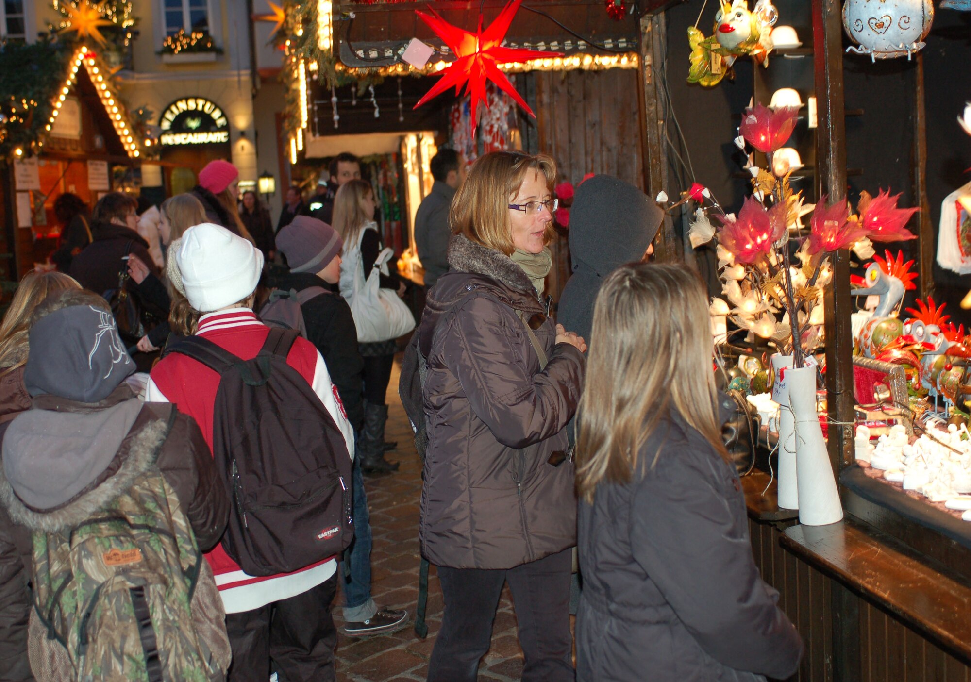 SPANGDAHLEM AIR BASE, Germany -- Visitors buy holiday gifts at Trier’s Weihnachtsmarkt Dec. 8 in the main market square in Trier. The market continues now through Dec. 22. Opening times are 10:30 a.m. - 8:30 p.m. Monday through Wednesday, 10:30 a.m. - 9:30 p.m. Thursday through Saturday, and 11 a.m. - 8:30 p.m. Sunday. Highlights include a performance by the U.S. Air Forces in Europe Brass Band from 6 - 7 p.m. Dec. 13. Music and entertainment is scheduled throughout each weekend, and Sankt Nikolaus will visit often. (U.S. Air Force photo/Iris Reiff)