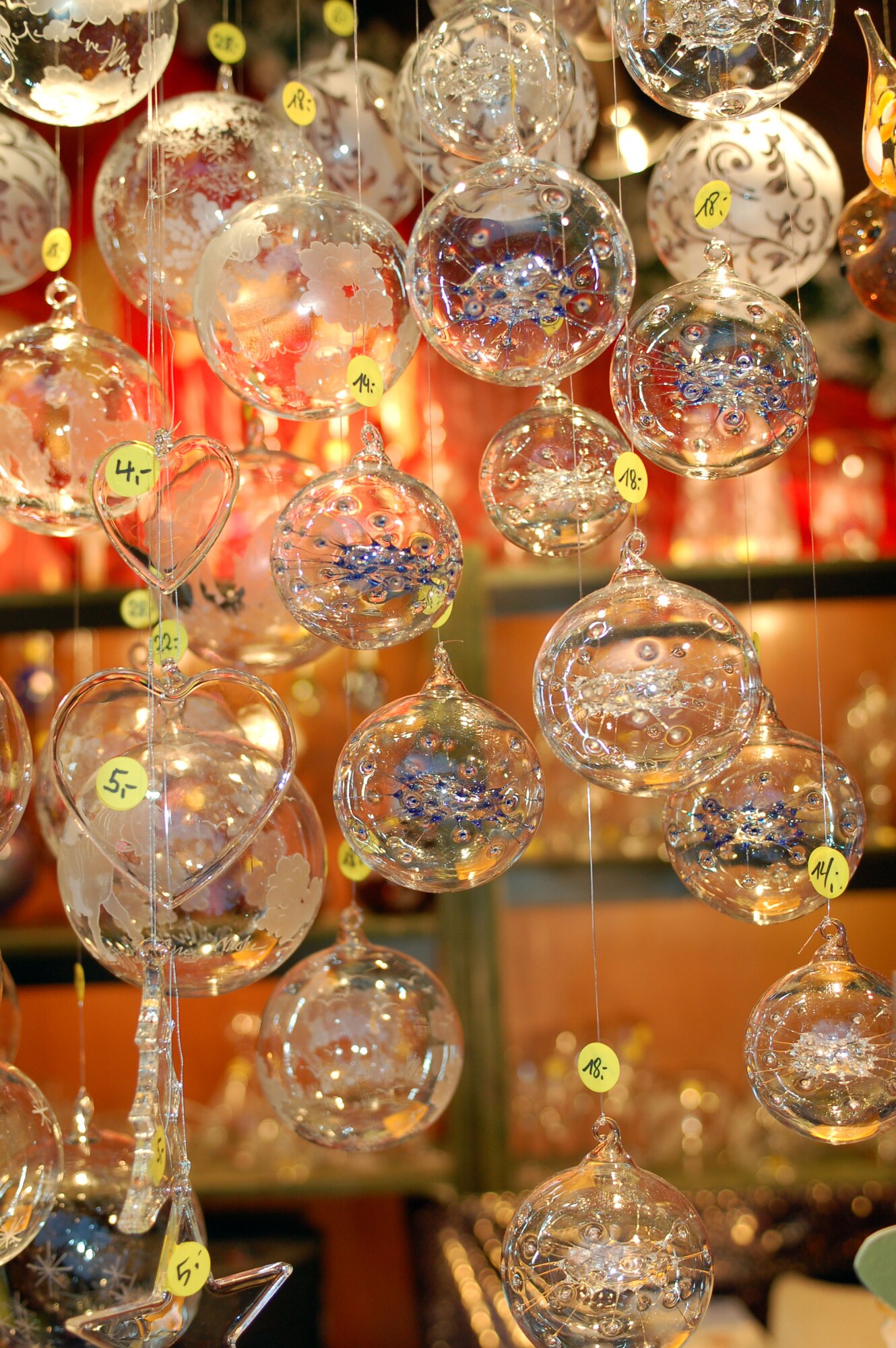 SPANGDAHLEM AIR BASE, Germany -- Glass decorative holiday ornaments hang from a sales booth at Trier’s Weihnachtsmarkt Dec. 8 in the main market square in Trier. Many different kinds of handmade wood, straw and glass ornaments are sold at this market now through Dec. 22. Opening times for the market are 10:30 a.m. - 8:30 p.m. Monday through Wednesday, 10:30 a.m. - 9:30 p.m. Thursday through Saturday, and 11 a.m. - 8:30 p.m. Sunday. Highlights include a performance by the U.S. Air Forces in Europe Brass Band from 6 - 7 p.m. Dec. 13. Music and entertainment is scheduled throughout each weekend, and Sankt Nikolaus will visit often. (U.S. Air Force photo/Iris Reiff)