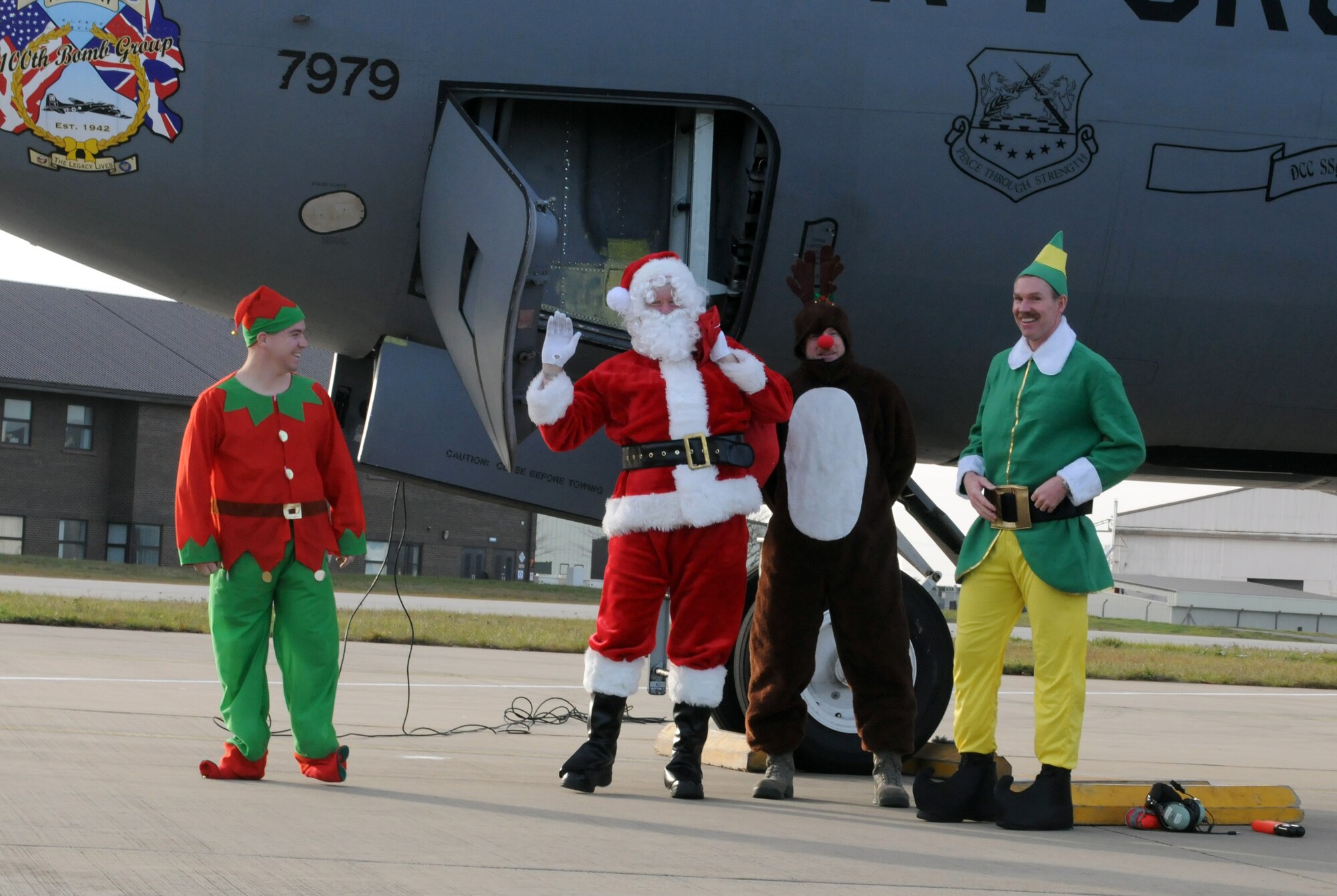 RAF MILDENHALL, England -- Santa Claus and his helpers disembark a KC-135 Statotanker here Dec. 10, 2011. Santa visited with RAF Mildenhall children during a holiday party in Hanger 803. (U.S. Air Force photo/ Staff Sgt. Tabitha M. Lee) 
