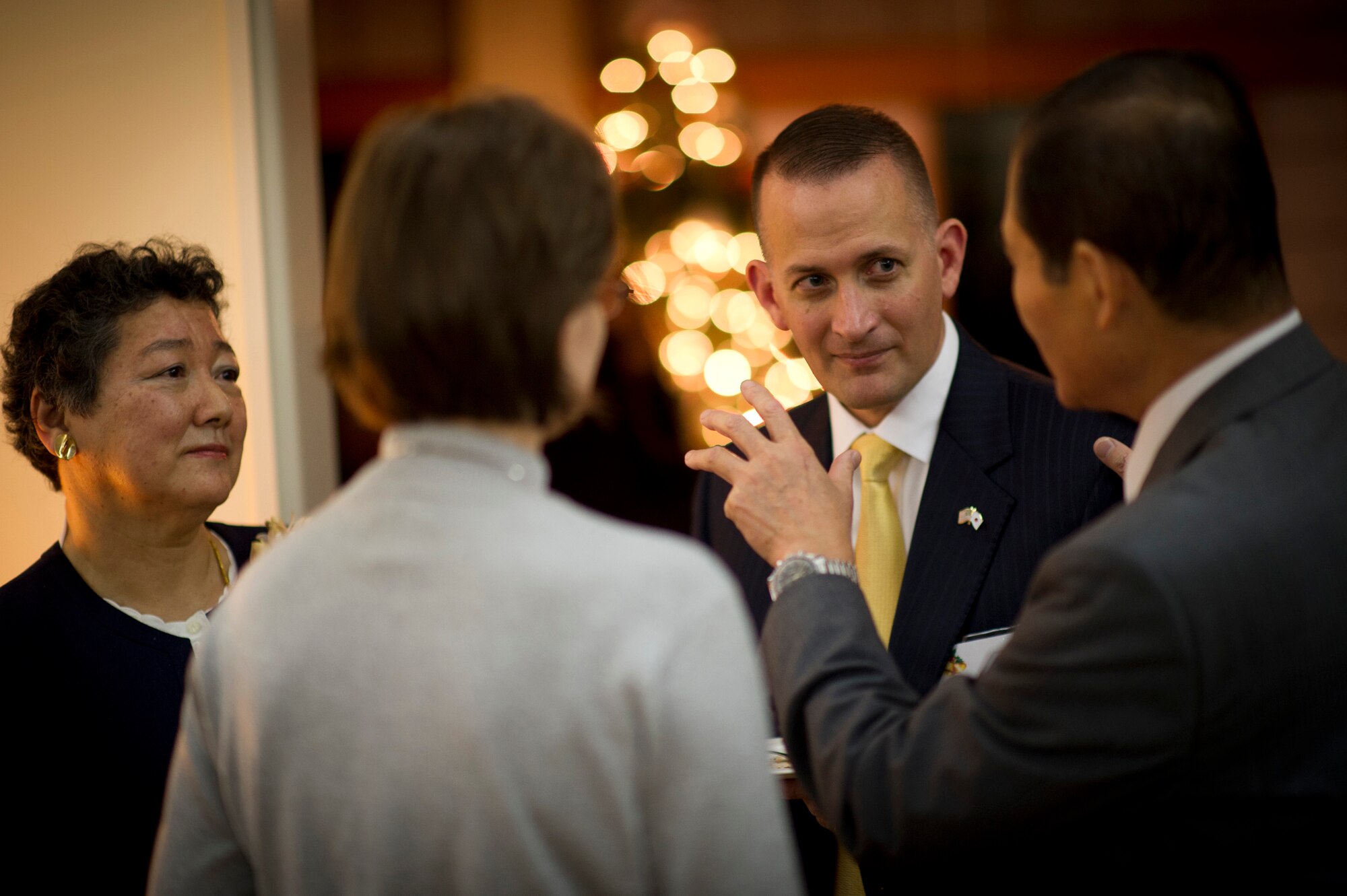 YOKOTA AIR BASE, Japan -- Col. Bill Knight, 374th Airlift Wing vice commander, speaks with guests at the house of Lt. Gen. Burton Field, U.S. Forces, Japan, and 5th Air Force commander, at Yokota Air Base, Japan, Dec. 3, 2011. Field held a holiday open house with U.S. and Japanese dignitaries to bolster bilateral relations with Japan. (U.S. Air Force photo/Staff Sgt. Samuel Morse)