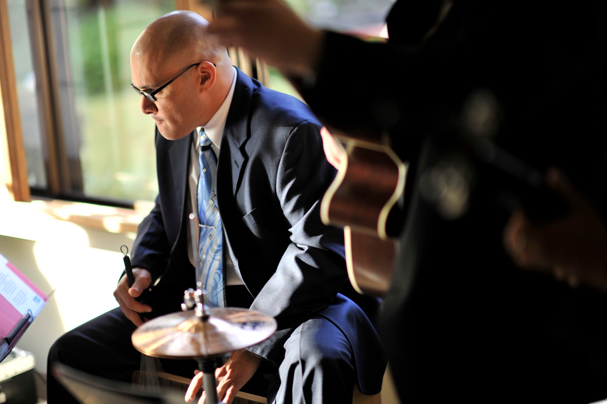 YOKOTA AIR BASE, Japan -- Staff Sgt. Wilfredo "Freddie" Cruz, drummer for Pacific Trends, a musical combo from the U.S. Air Force Band of the Pacific, Asia, performs at the house of Lt. Gen. Burton Field, U.S. Forces, Japan, and 5th Air Force commander, at Yokota Air Base, Japan, Dec. 3, 2011. Field held a holiday open house with U.S. and Japanese dignitaries to bolster bilateral relations with Japan. (U.S. Air Force photo/Staff Sgt. Samuel Morse)